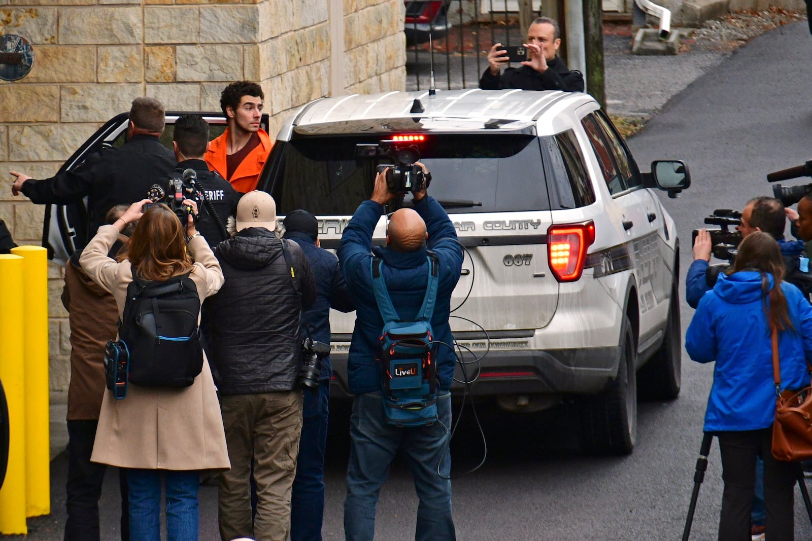 Suspect Luigi Mangione is taken into the Blair County Courthouse on Tuesday, Dec. 10, 2024, in Hollidaysburg, Pa. (Janet Klingbeil via AP)