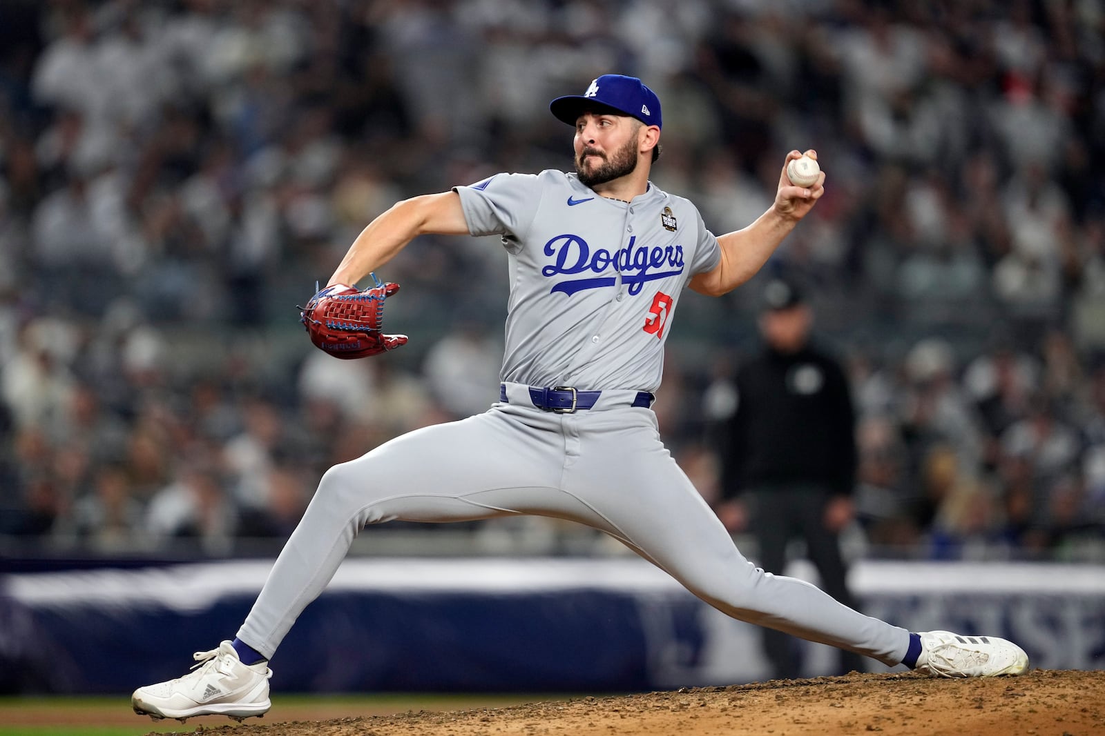 Los Angeles Dodgers pitcher Alex Vesia throws against the New York Yankees during the fifth inning in Game 5 of the baseball World Series, Wednesday, Oct. 30, 2024, in New York. (AP Photo/Godofredo A. Vásquez)