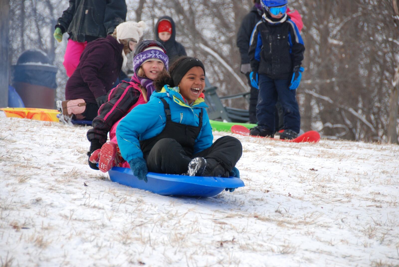 Proper winter wear can make an afternoon of sledding more fun. These young sledders enjoy Taylorsville MetroPark. AMY FORSTHOEFEL/CONTRIBUTED