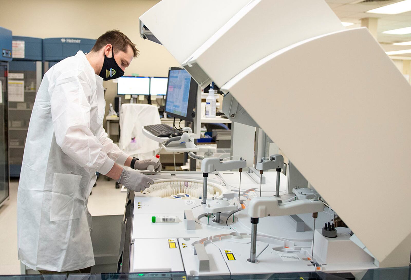 Tech. Sgt. Greg Railey, a medical technician with the 88th Medical Group, performs routine cleaning on a machine inside the laboratory of the Wright-Patterson Medical Center April 28. U.S. AIR FORCE PHOTO/WESLEY FARNSWORTH