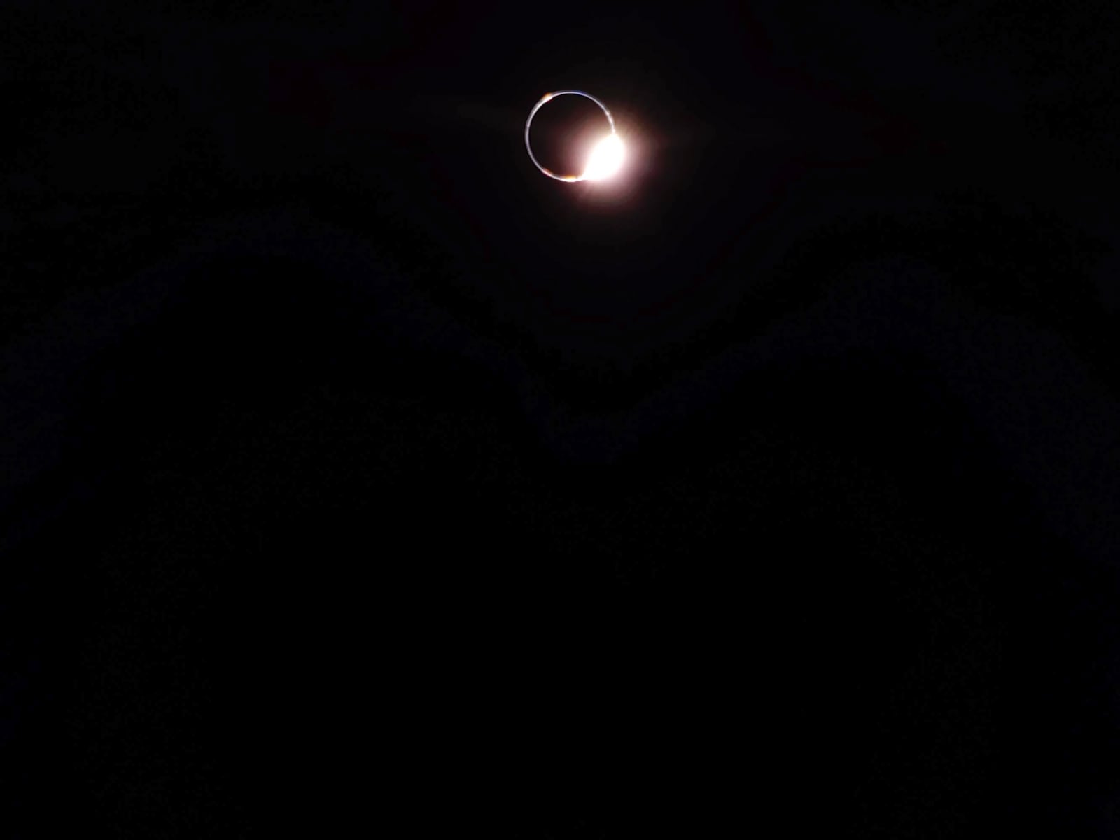 This image provided by NASA/Firefly Aerospace shows the sun about to emerge from totality behind Earth. (NASA/Firefly Aerospace via AP)