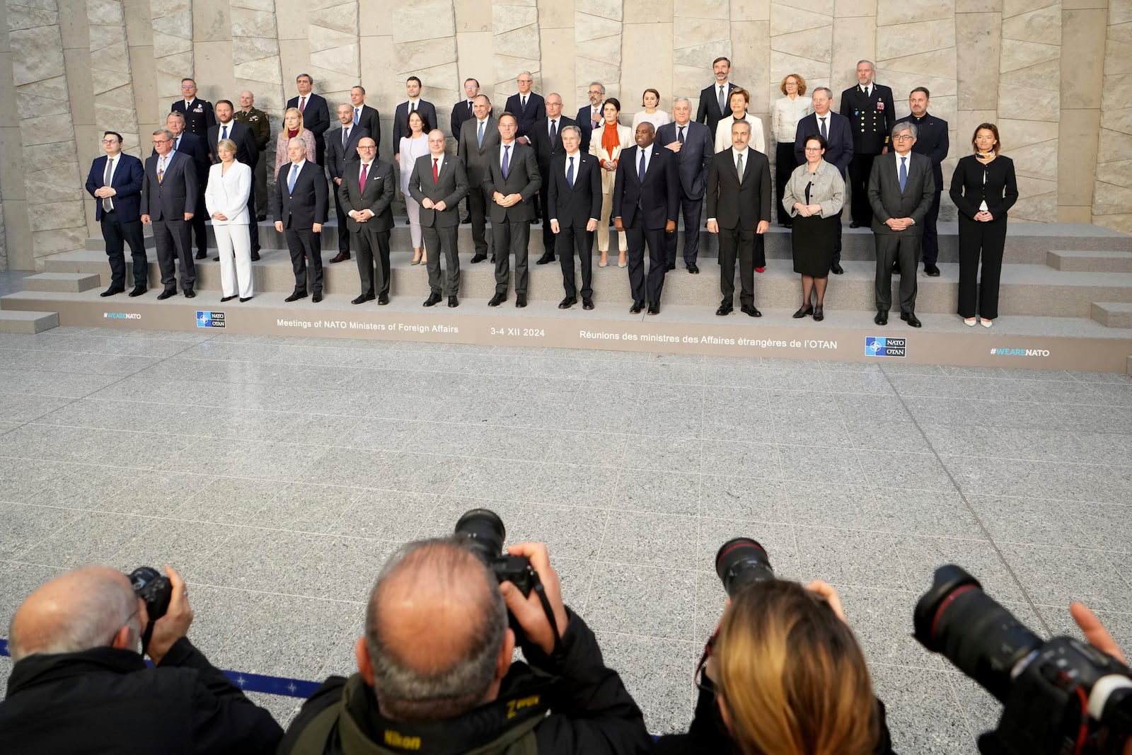 NATO foreign ministers pose for a group photo during a meeting of NATO foreign ministers at NATO headquarters in Brussels, Wednesday, Dec. 4, 2024. (AP Photo/Virginia Mayo)