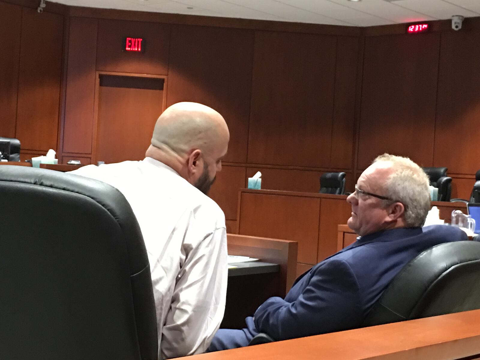 Freddie Green talks to lawyer Jeff Richards during his first trial on charges he murdered his father in December in Lebanon.