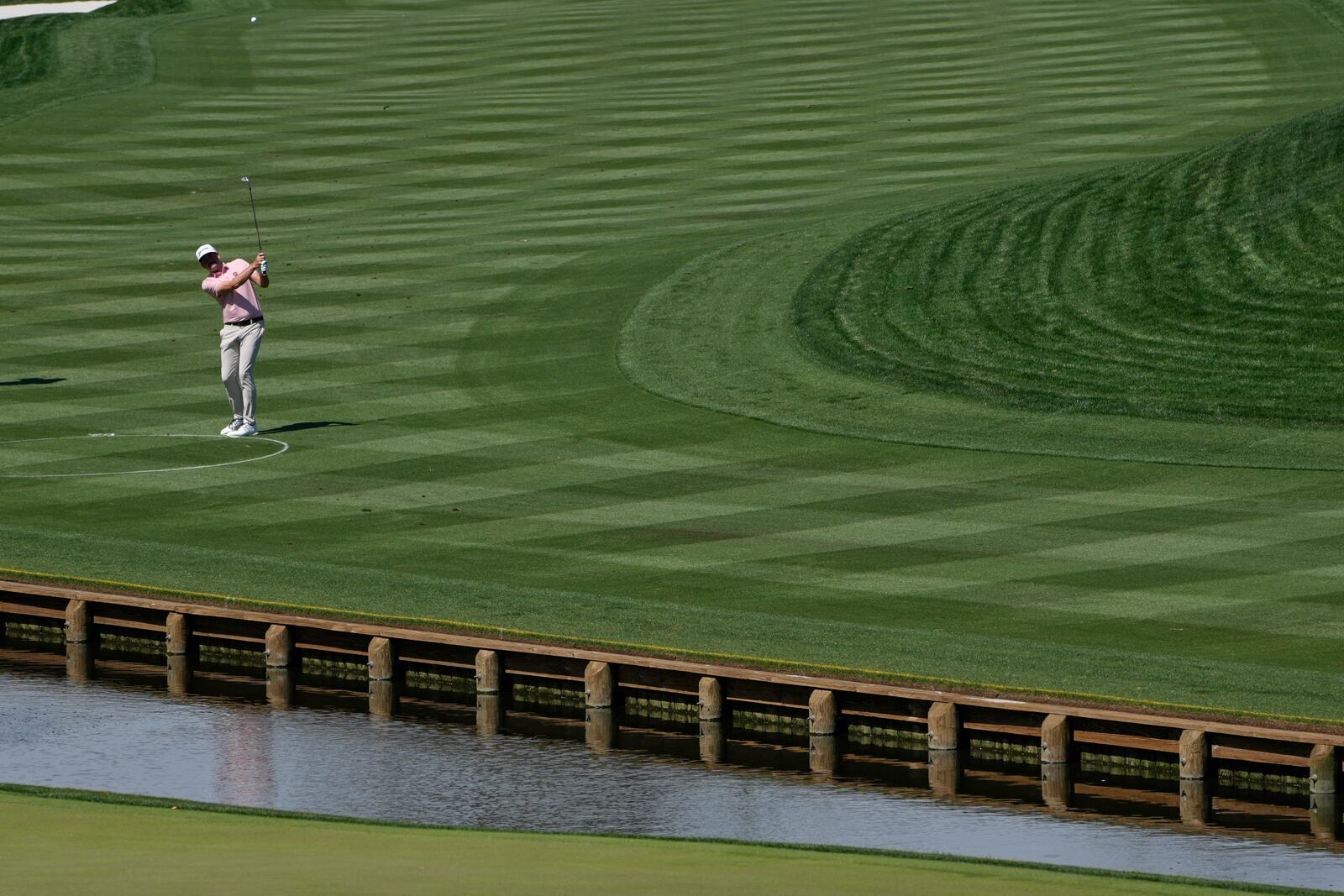 Keegan Bradley hits from the drop zone on the fourth hole during the first round of The Players Championship golf tournament Thursday, March 13, 2025, in Ponte Vedra Beach, Fla. (AP Photo/Julia Demaree Nikhinson)