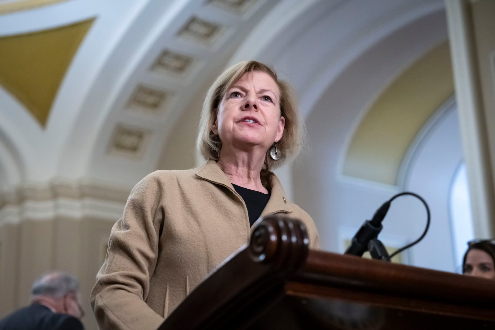 Sen. Tammy Baldwin, D-Wis., speaks to reporters after a Senate policy luncheon, at the Capitol in Washington, Tuesday, Feb. 25, 2025. (AP Photo/Ben Curtis)