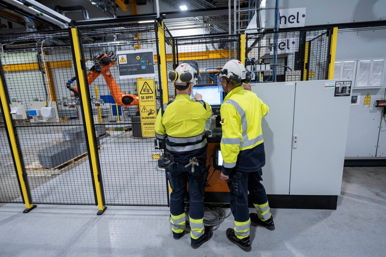 FILE - Employees work at a facility for the Norwegian company Nel in Heroya, Norway, on April 20, 2023. (AP Photo/Trond R. Teigen, File)