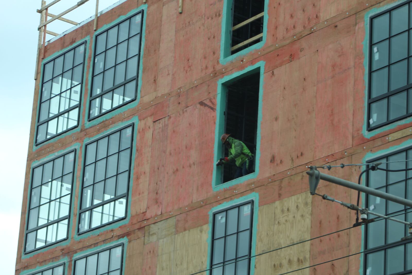 Construction continues on the AC Hotel by Marriott, which is a $23 million new hotel located across from Day Air Ballpark, home to the Dayton Dragons. CORNELIUS FROLIK / STAFF