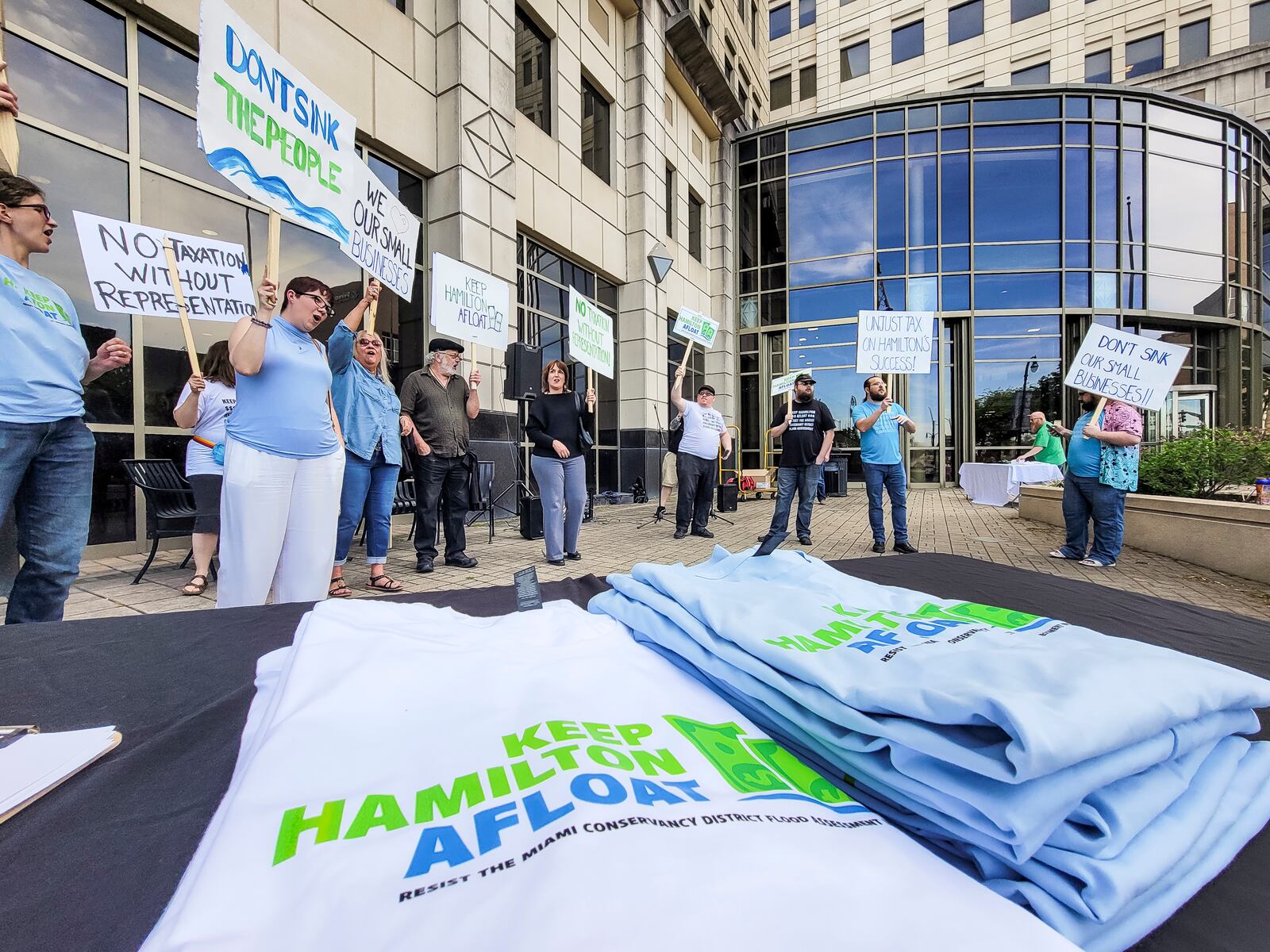 Concerned citizens rally against the Miami Conservancy District assessment increase in front of the Hamilton Municpal Building before a special meeting to discuss the issue Thursday, April 18, 2024 in Hamilton. NICK GRAHAM/STAFF