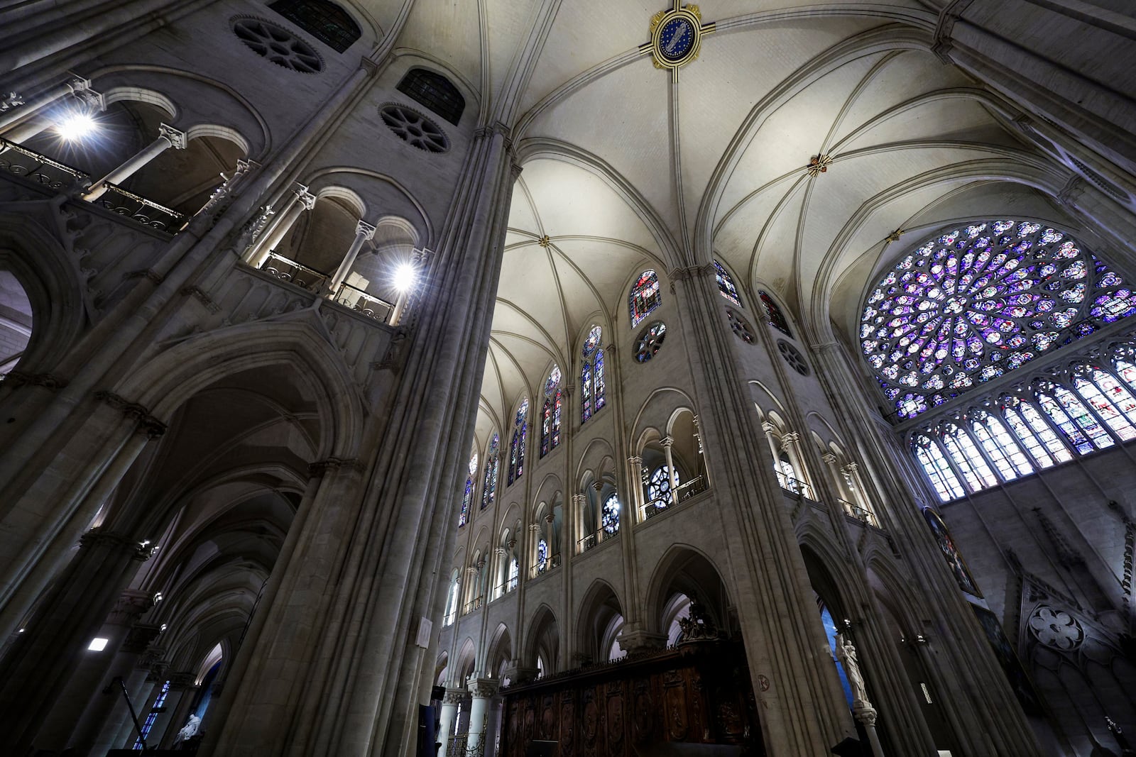 The South Rose stainglass window of Notre-Dame de Paris cathedral is seen while French President Emmanuel Macron visits the restored interiors of the cathedral, Friday Nov. 29, 2024, in Paris. (Stephane de Sakutin, Pool via AP)