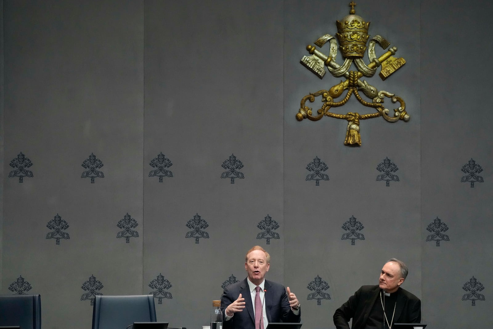 Cardinal Mauro Gambetti, right, and Microsoft's vice-Chairman and President Brad Smith unveil the project "St. Peter's Basilica: AI-Enhanced Experience" during a press conference at the Vatican, Monday, Nov. 11, 2024. (AP Photo/Gregorio Borgia)