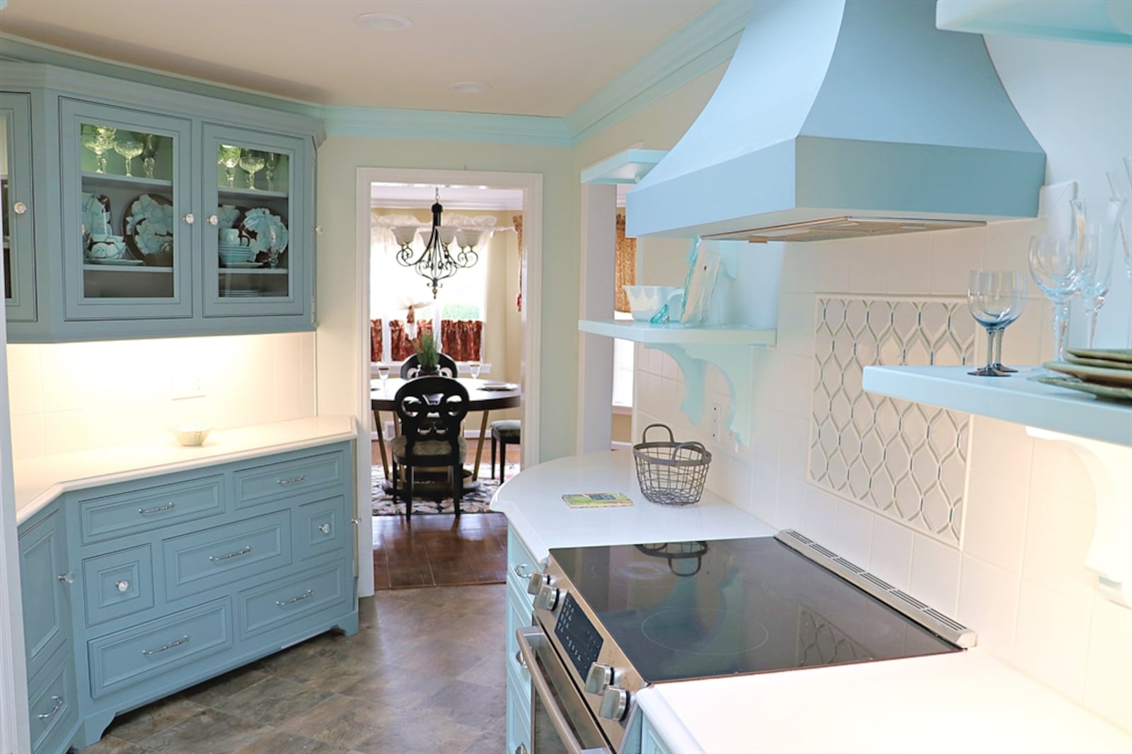 The updated galley-style kitchen has white solid-surface quartz counters with beveled edges. CONTRIBUTED BY KATHY TYLER