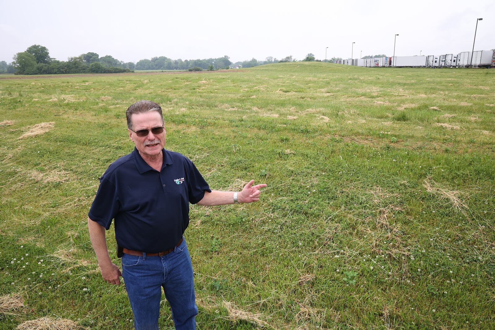 In this file photo John Maurer, from Esterline & Sons Manufacturing, describes what the company's new location at Airpark Ohio will look like. Significant progress has since been made to the site and the new facility is expected to be operational this fall. BILL LACKEY/STAFF