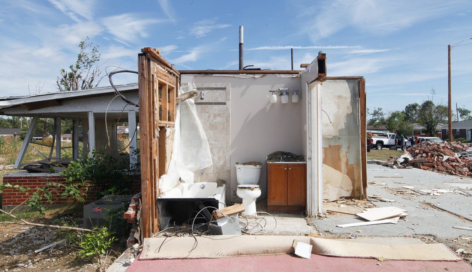 Tornado damage remains evident in Brookville’s Terrace Park neighborhood. This house is being slowly demolished as others have already been repaired or in process of being rebuilt. Some foundations that have been cleared face uncertain futures. CHRIS STEWART / STAFF