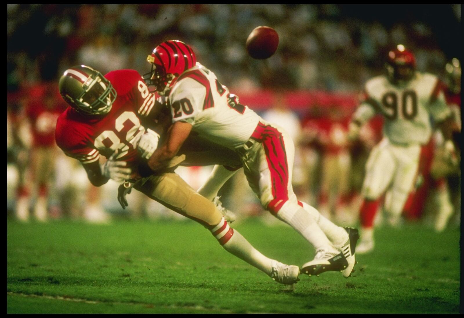 22 Jan 1989: Safety Ray Horton #20 of the Cincinnati Bengals stops wide receiver John Taylor #82 of the San Francisco 49ers during Super Bowl XXII at the Joe Robbie Stadium in Miami, Florida. The 49ers won over the Bengals, 20-16. (Getty Images)