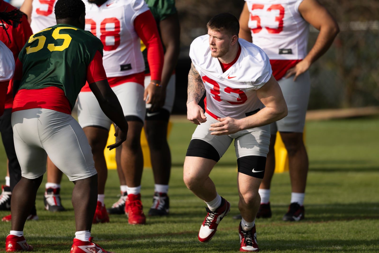 Ohio State defensive end Jack Sawyer, right, runs during practice in Carson, Calif., Monday, Dec. 30, 2024, ahead of Wednesday's Rose Bowl College Football Playoff against Oregon. (AP Photo/Kyusung Gong)