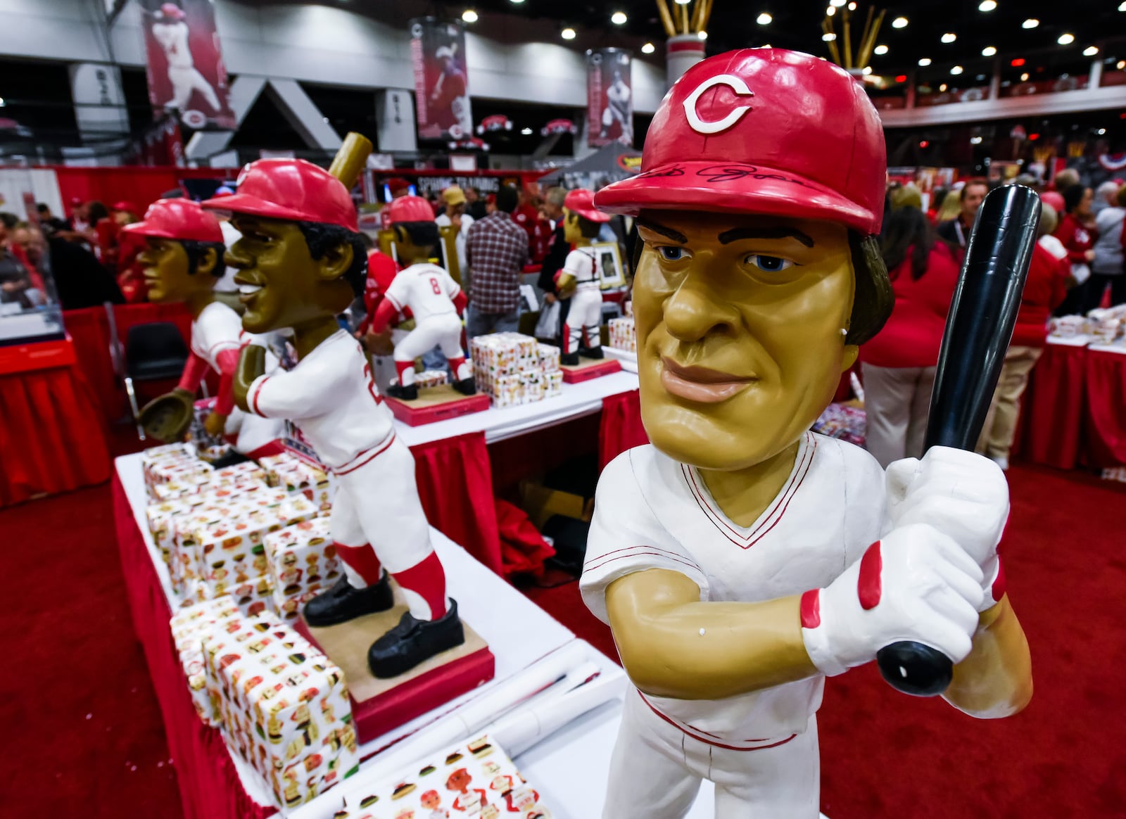 A 2016 Redsfest booth was decorated with oversized bobbleheads of former Reds players. NICK GRAHAM/STAFF