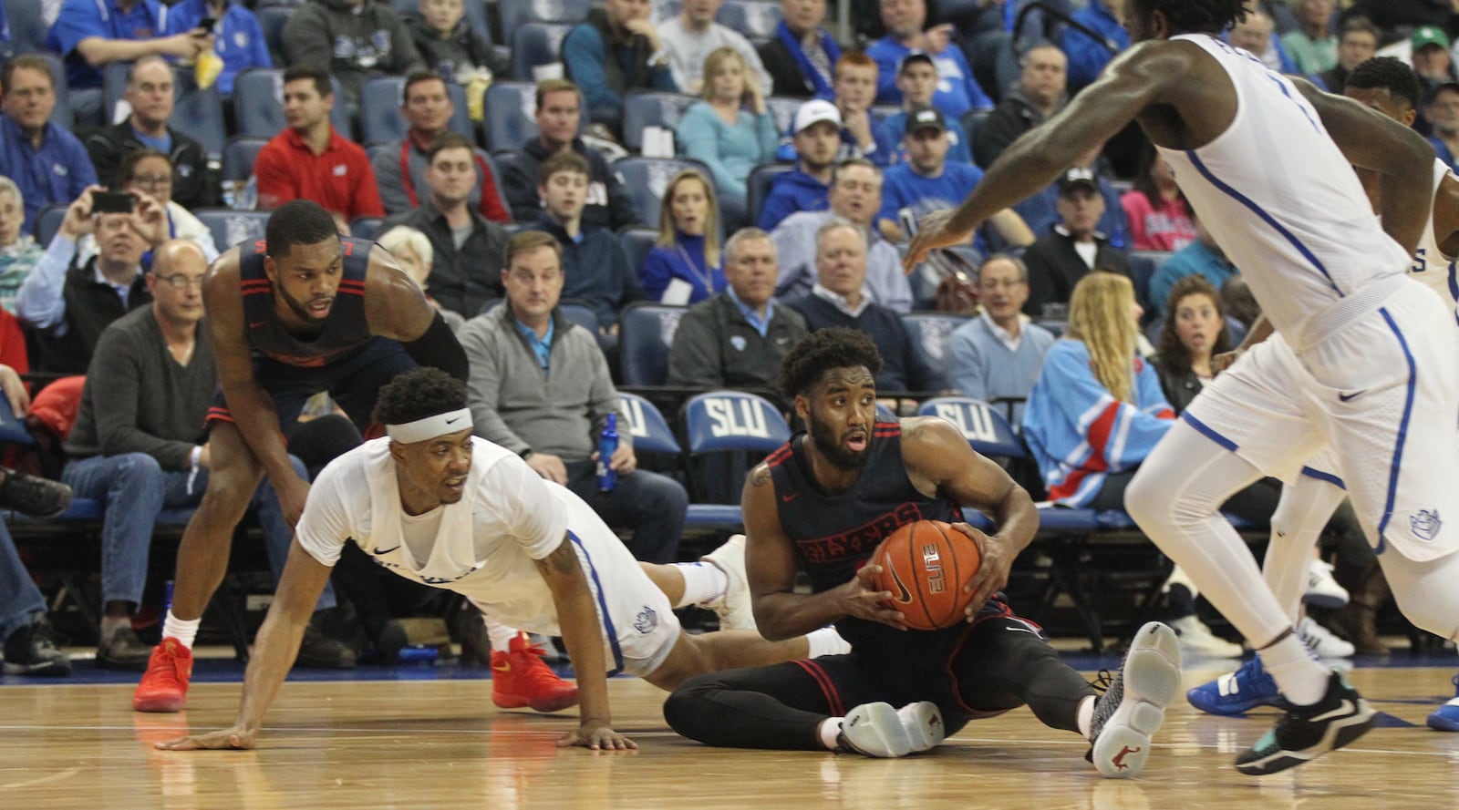 Dayton's Josh Cunningham grabs a loose ball in the final minute of the first half against Saint Louis on Tuesday, Feb. 5, 2019, at Chaifetz Arena in St. Louis.