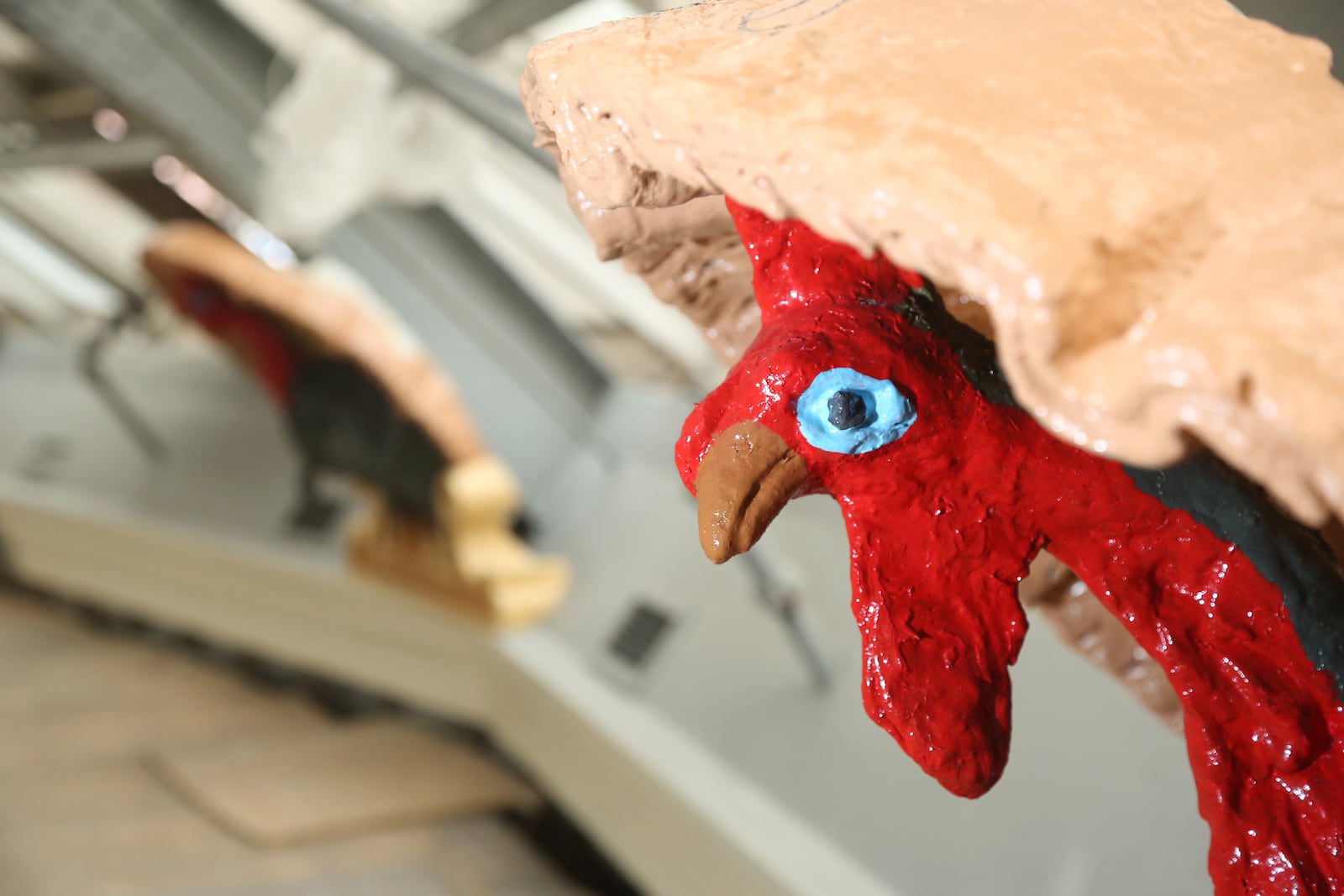 Local artist John Landsiedel has refurbished 16 plaster turkeys that circle the top of the dome in the Dayton Arcade. Landsiedel's grandfather, Byron Landsiedel, created the turkeys more than 100 years ago. LISA POWELL / STAFF