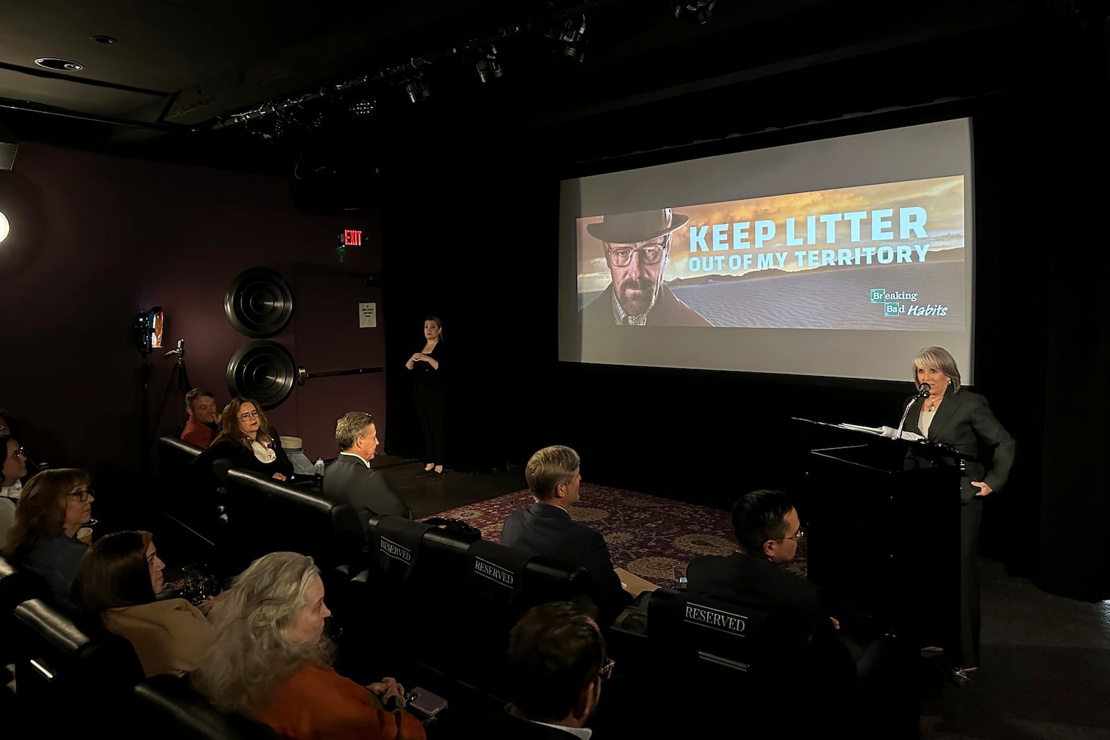 New Mexico Gov. Michelle Lujan Grisham introduces a public service ad campaign against littering that features "Breaking Bad" actor Bryan Cranston in a reprise of the series' character Walter White, on Thursday, Oct. 17, 2024, in Santa Fe, N.M.. (AP Photo/Morgan Lee)