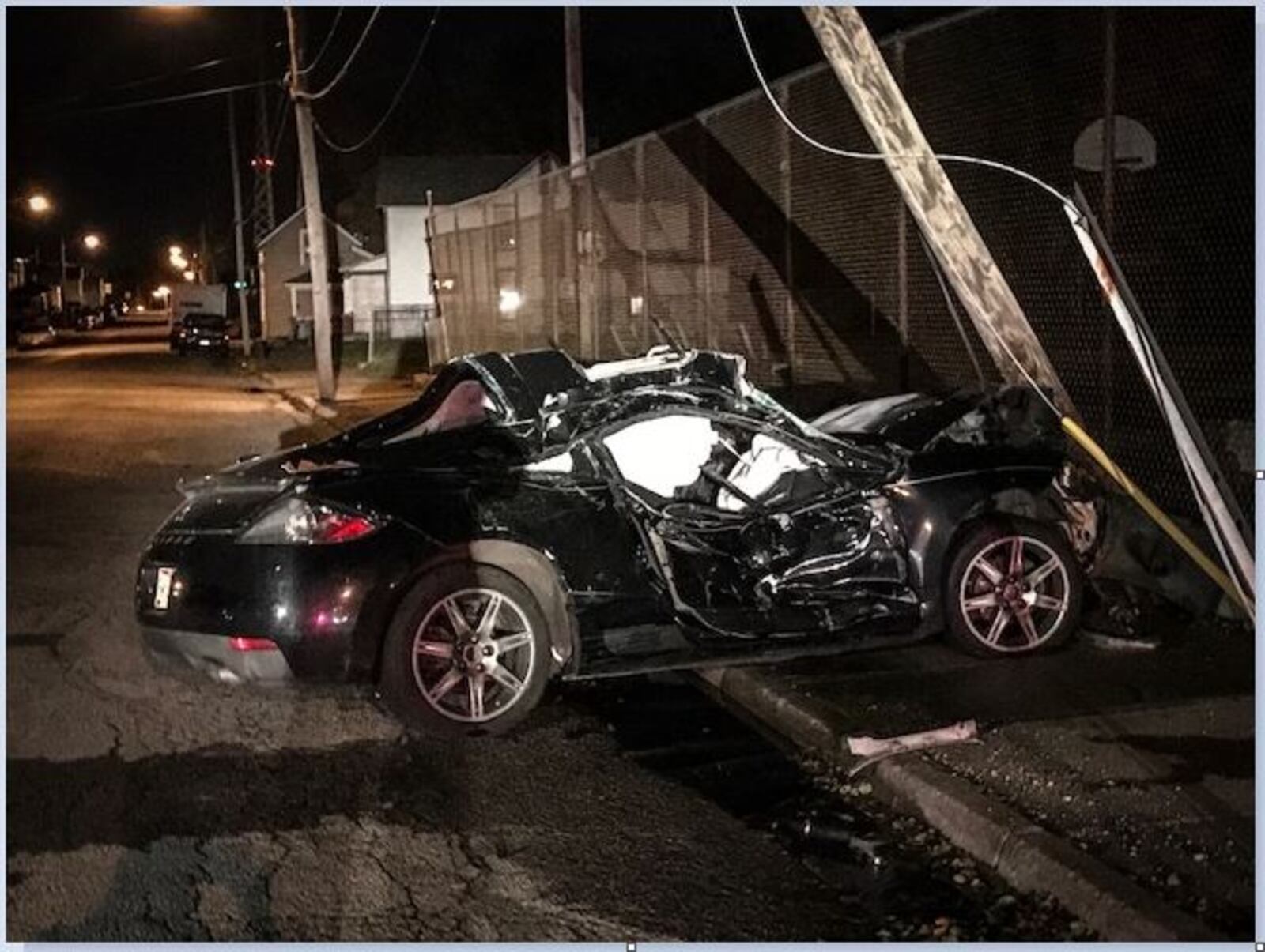 The driver of this car, with a baby inside, was knocked unconscious and hit a pole on York Street in Springfield on Tuesday night, police said. (Jim Noelker/Staff)