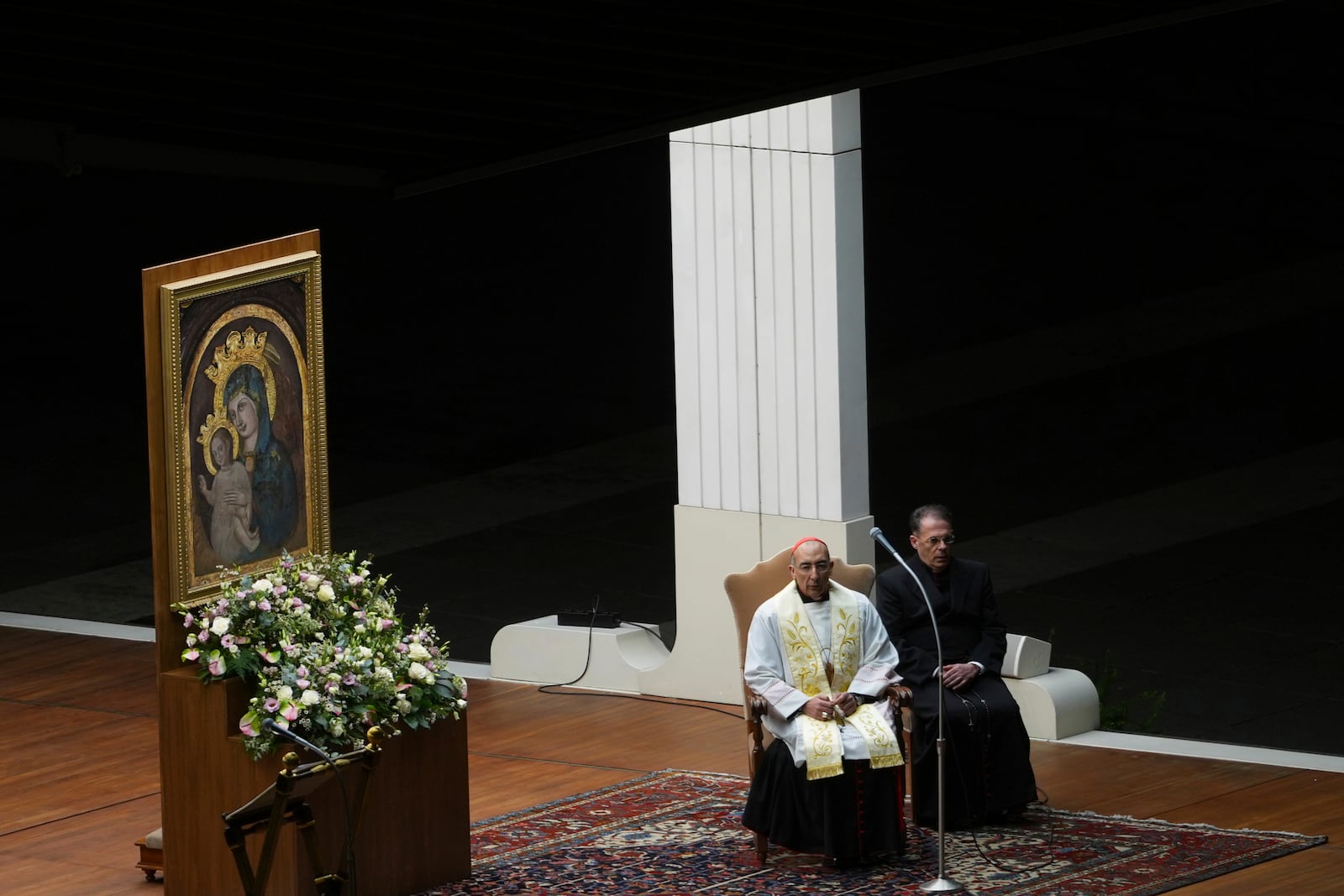 The Pope's vicar for the dioceses of Rome Cardinal Baldassarre Reina, left, during a rosary prayer held for the health of Pope Francis in St Peter's Square at The Vatican, Thursday, Feb. 27, 2025. (AP Photo/Kirsty Wigglesworth)