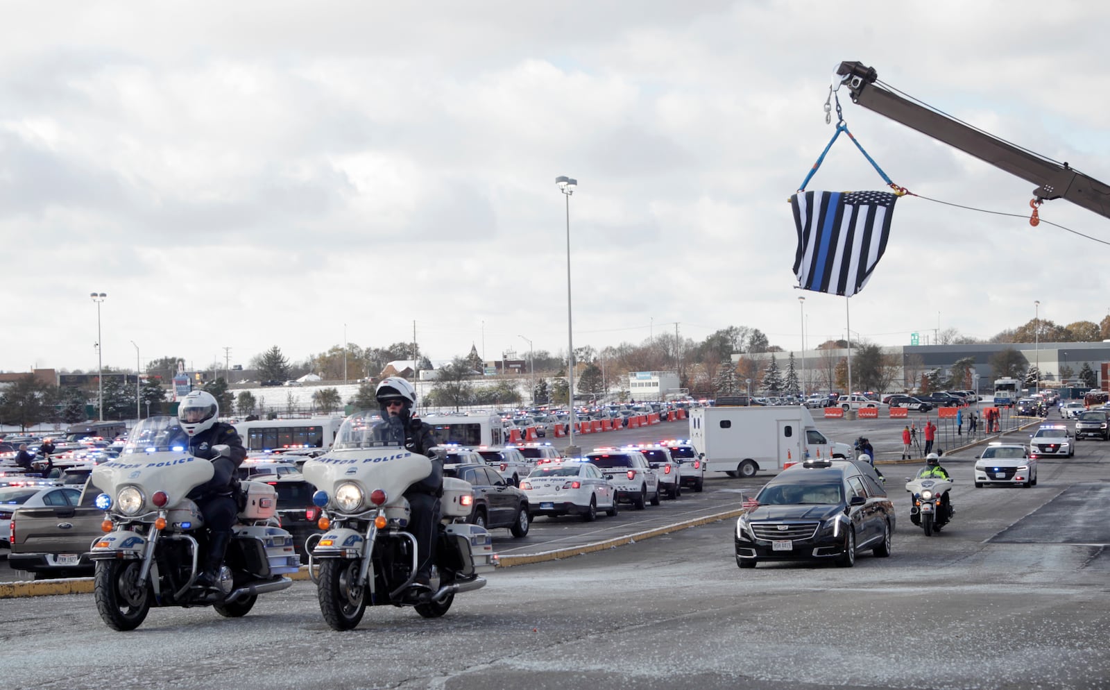 The funeral procession for Dayton Police detective Jorge DelRio leaves the University of Dayton after the funeral Tuesday, Nov. 12. LISA POWELL / STAFF