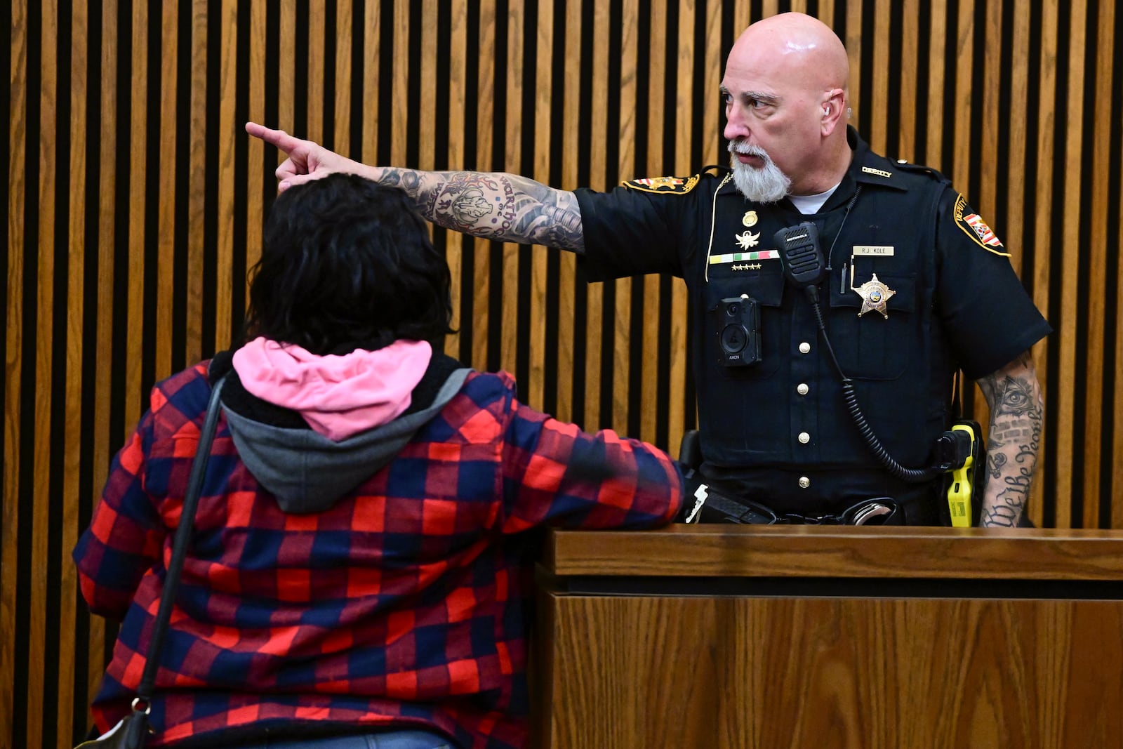 Fiona Allen received instructions from a Sheriffs deputy after being arraigned in Cuyahoga County Common Pleas Court,, Tuesday, Dec. 3, 2024. Allen is accused of illegally voting in five different elections since 2020. Though Allen is a legal resident of the United States, prosecutors say she is not an American citizen. (AP Photo/David Dermer)