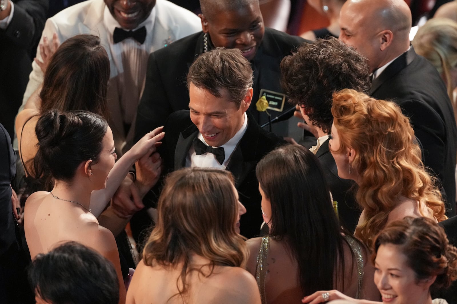 Mikey Madison, left, and Sean Baker appear in the audience during the Oscars on Sunday, March 2, 2025, at the Dolby Theatre in Los Angeles. (AP Photo/Chris Pizzello)