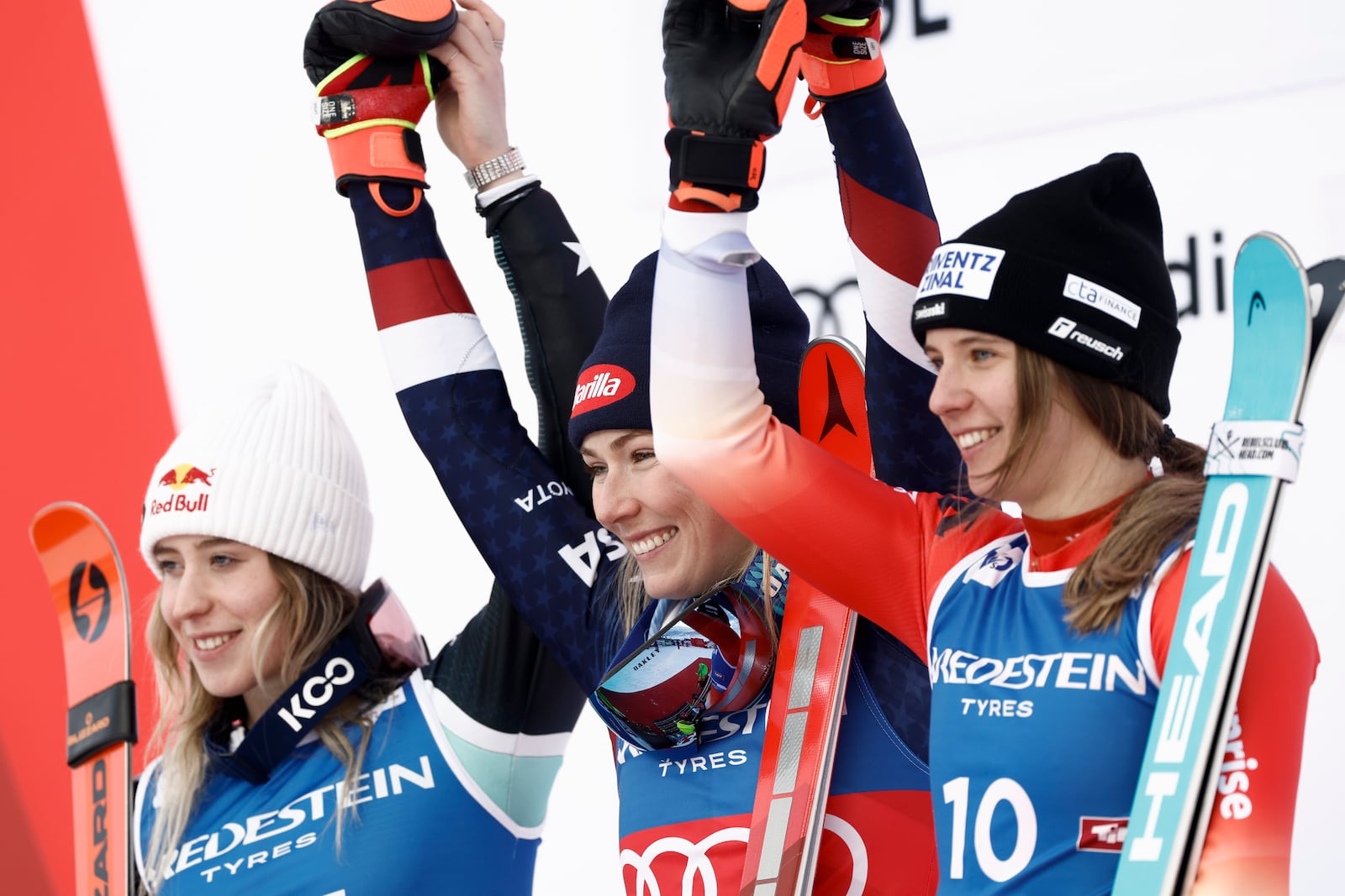 United States' Mikaela Shiffrin, center, winner of an alpine ski, women's World Cup slalom, celebrates with second-placed Albania's Lara Colturi, left, and third-placed Switzerland's Camille Rast, in Gurgl, Austria, Saturday, Nov. 23, 2024. (AP Photo/Gabriele Facciotti)