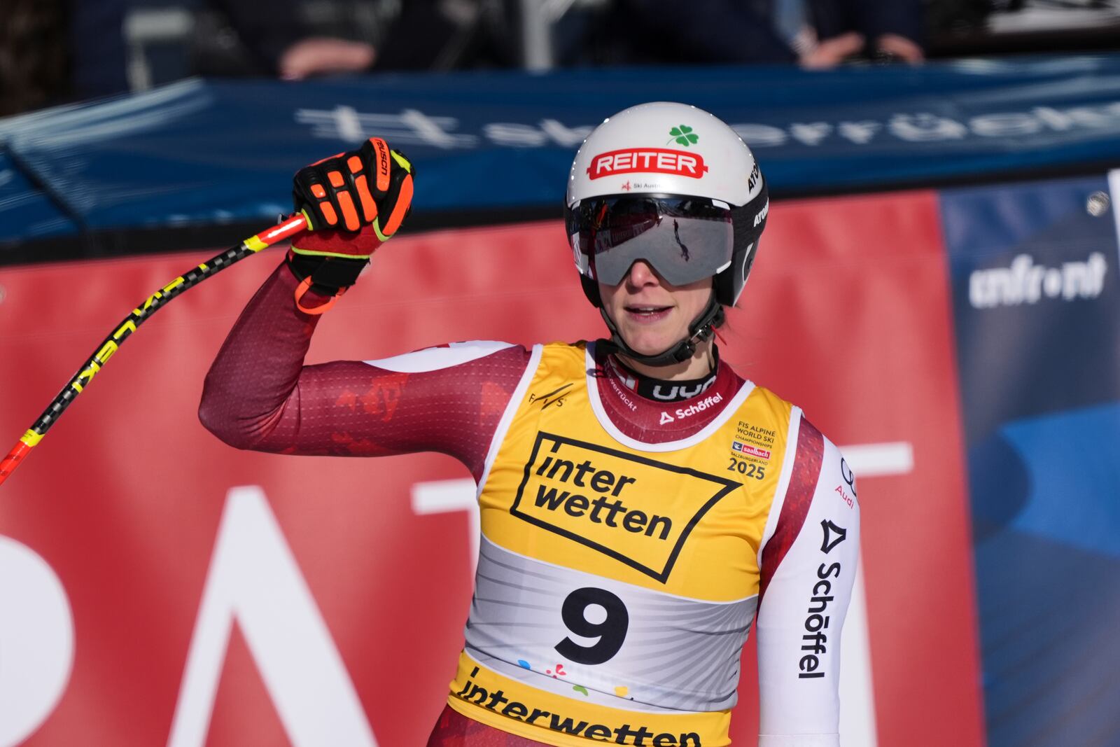 Austria's Mirjam Puchner celebrates at the finish area of a women's downhill race, at the Alpine Ski World Championships, in Saalbach-Hinterglemm, Austria, Saturday, Feb. 8, 2025. (AP Photo/Giovanni Auletta)