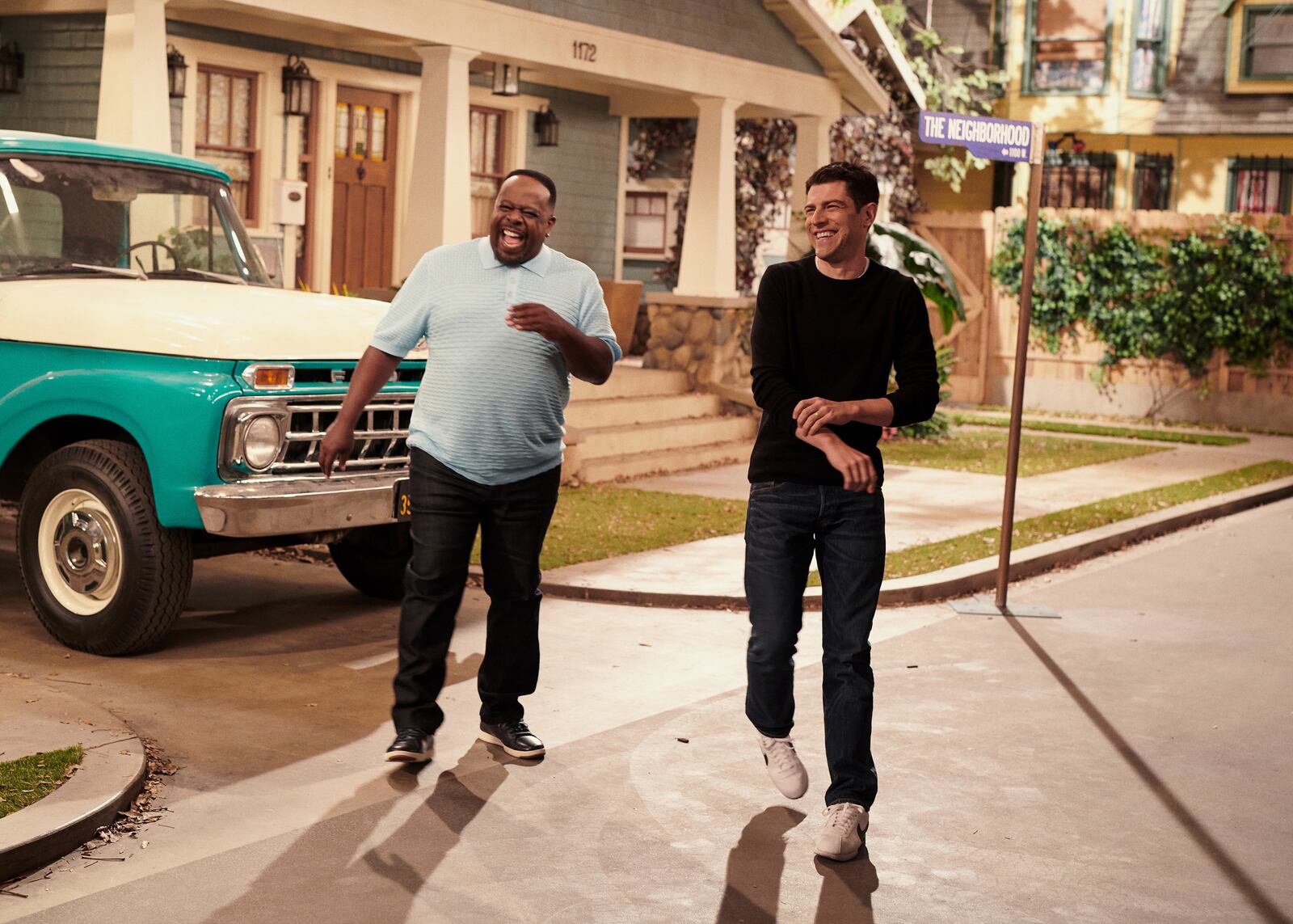 Cedric the Entertainer, left, and Max Greenfield on the set of their show "The Neighborhood," in Los Angeles, Sept. 19, 2018. The stars of the new sitcom "The Neighborhood" discuss why multi-cam comedies still matter and the current spotlight on CBS. (Jake Michaels/The New York Times)