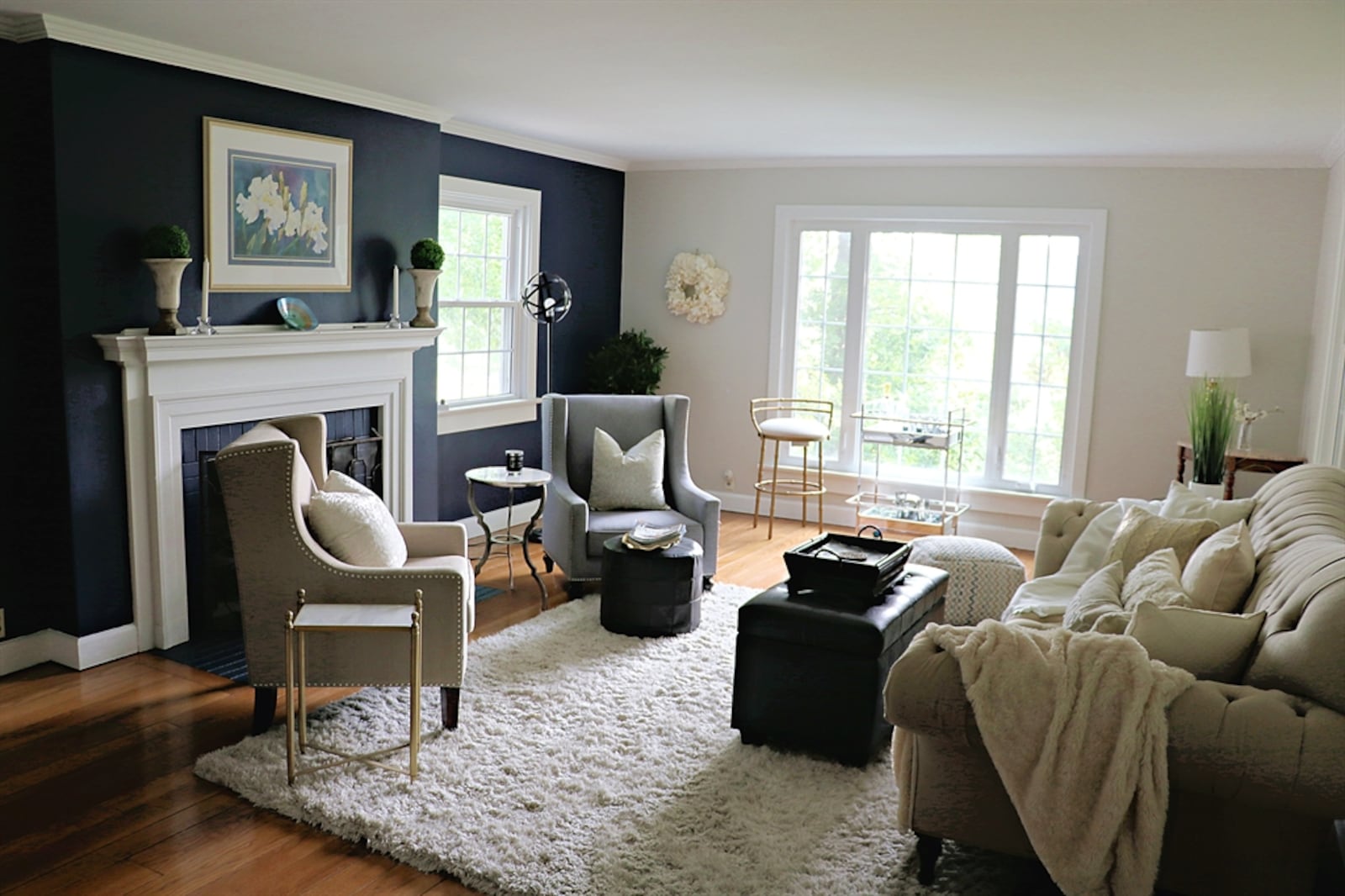 The formal living room has a decorative fireplace with a painted-brick surround and wooden mantel. 