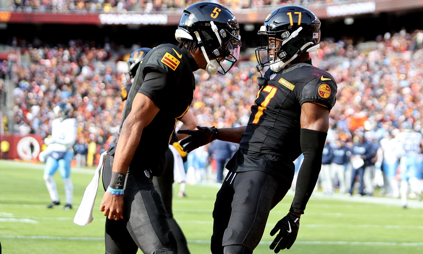 FILE - Washington Commanders quarterback Jayden Daniels (5) celebrates with Washington Commanders wide receiver Terry McLaurin (17) during an NFL football game against the Tennessee Titans, Dec. 1, 2024 in Landover, Md. (AP Photo/Daniel Kucin Jr., File)