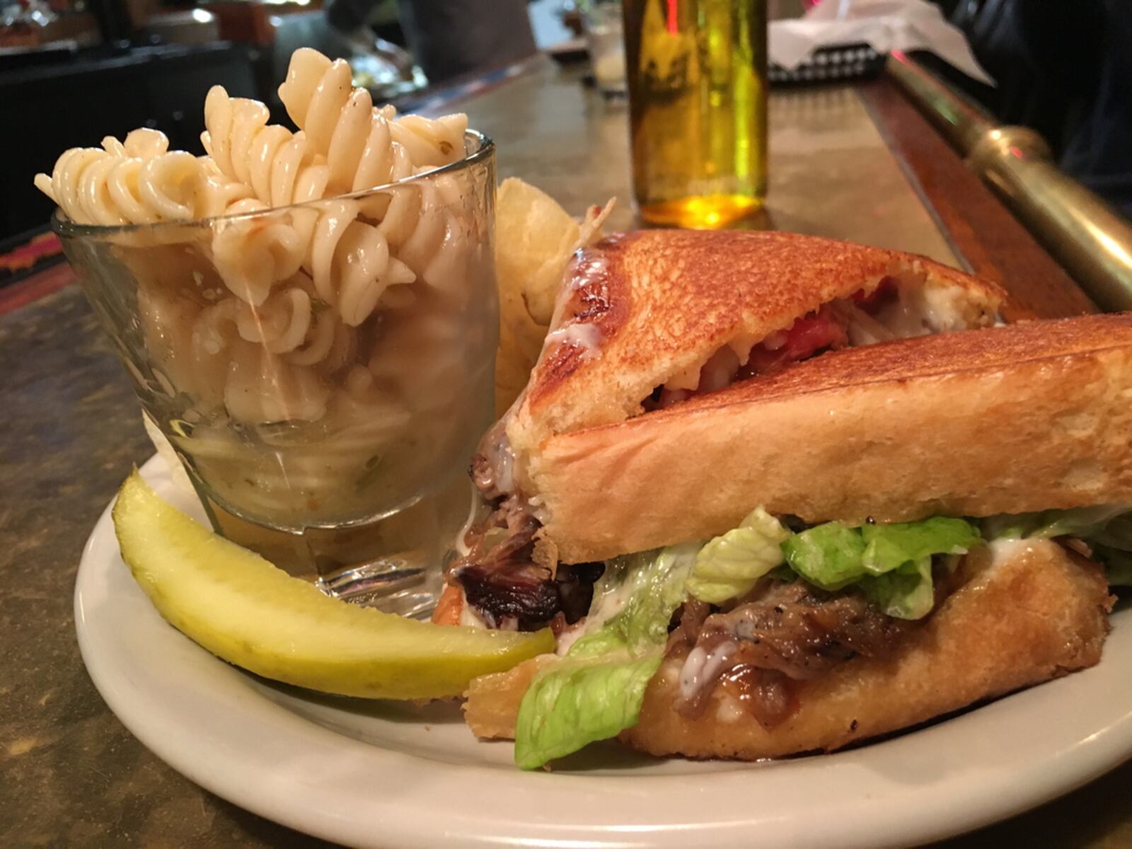 A Hannah's Bar and Restaurant beef sandwich with pasta salad, chips and a pickle.  Photo: Amelia Robinson, staff.