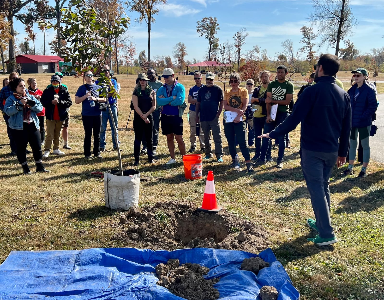 Volunteers get a quick lesson in tree planting during Saturday's TREEcovery Campaign event. AIMEE HANCOCK/STAFF