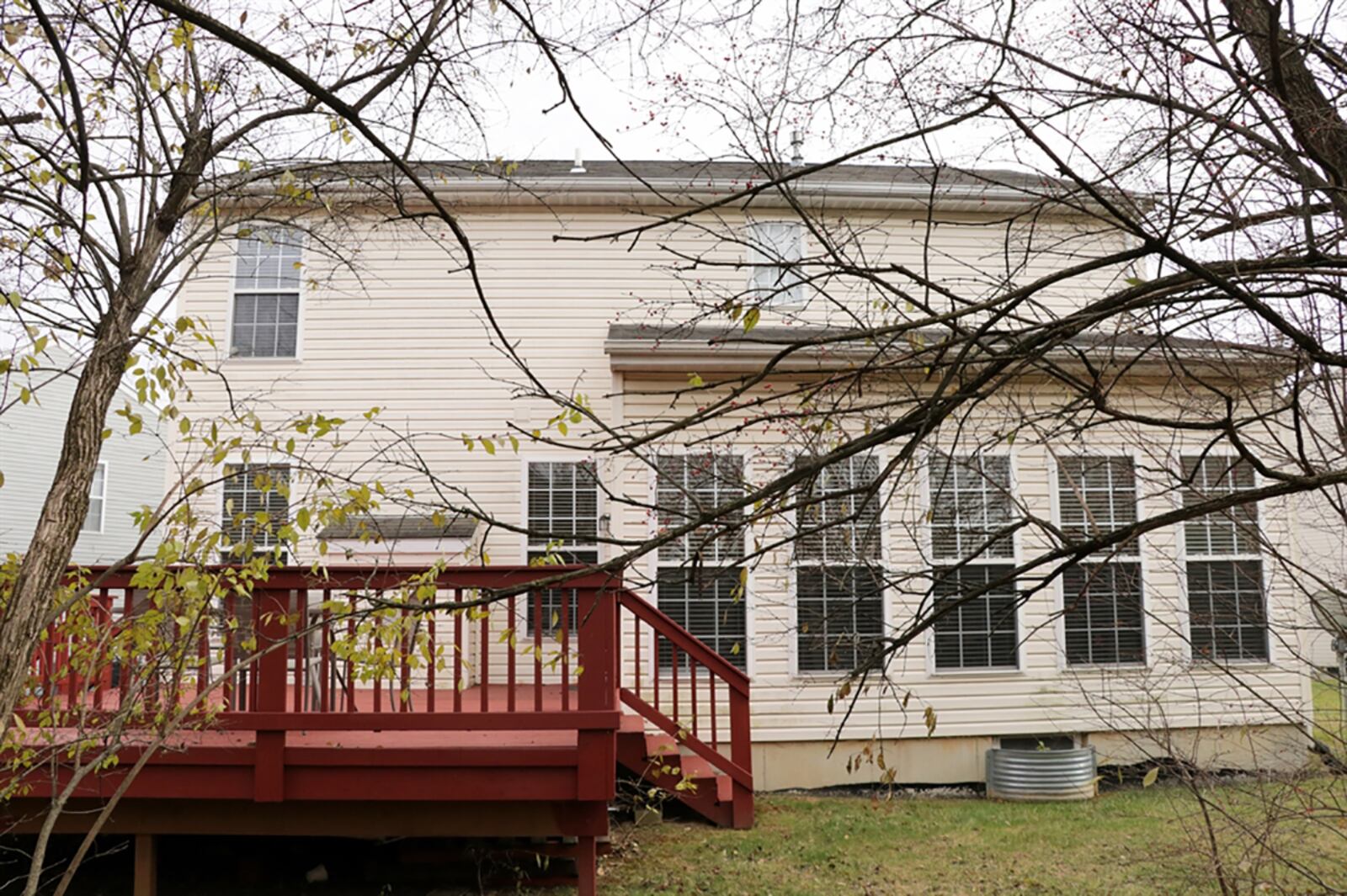 An oversized wooden deck extends into the tree-lined back yard. The deck is accessible from the morning room with vaulted ceiling and walls of windows. CONTRIBUTED PHOTO BY KATHY TYLER