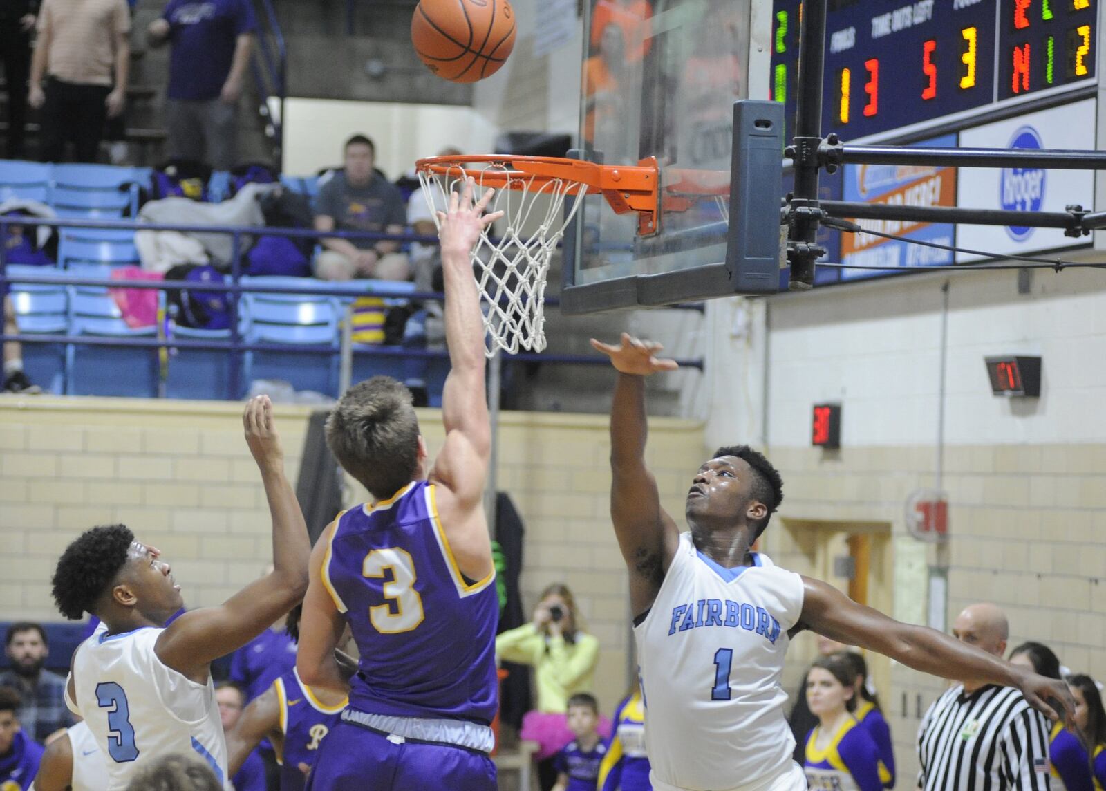 Butler’s Michael Kreill shoots over Fairborn defenders Shaunn Monroe (left) and Otis Person. Butler defeated host Fairborn 68-53 in a boys high school basketball game on Friday, Jan. 4, 2019. MARC PENDLETON / STAFF