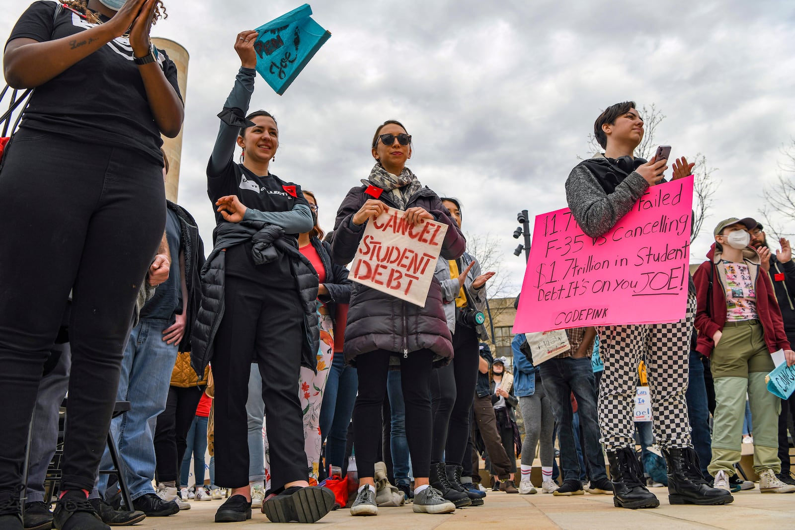 FILE — Protesters call for the cancellation of student loan debt during a rally outside the Education Department in Washington on April 4, 2022. The question of how far the United States should go in providing debt forgiveness has emerged as one of the most contentious issues for President Joe Biden. (Kenny Holston/The New York Times)