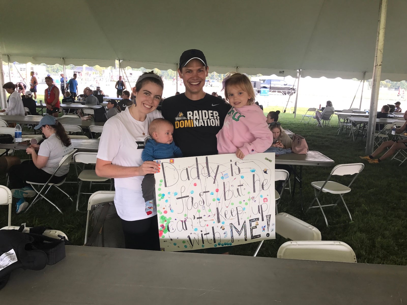 Men’s half-marathon runner-up and former Wright State distance runner Jason Bruns with wife Liz, a former Wright State tennis playerand their children, 5 month old son Wilbur and 3-year-old daughter Hazel. Tom Archdeacon/STAFF