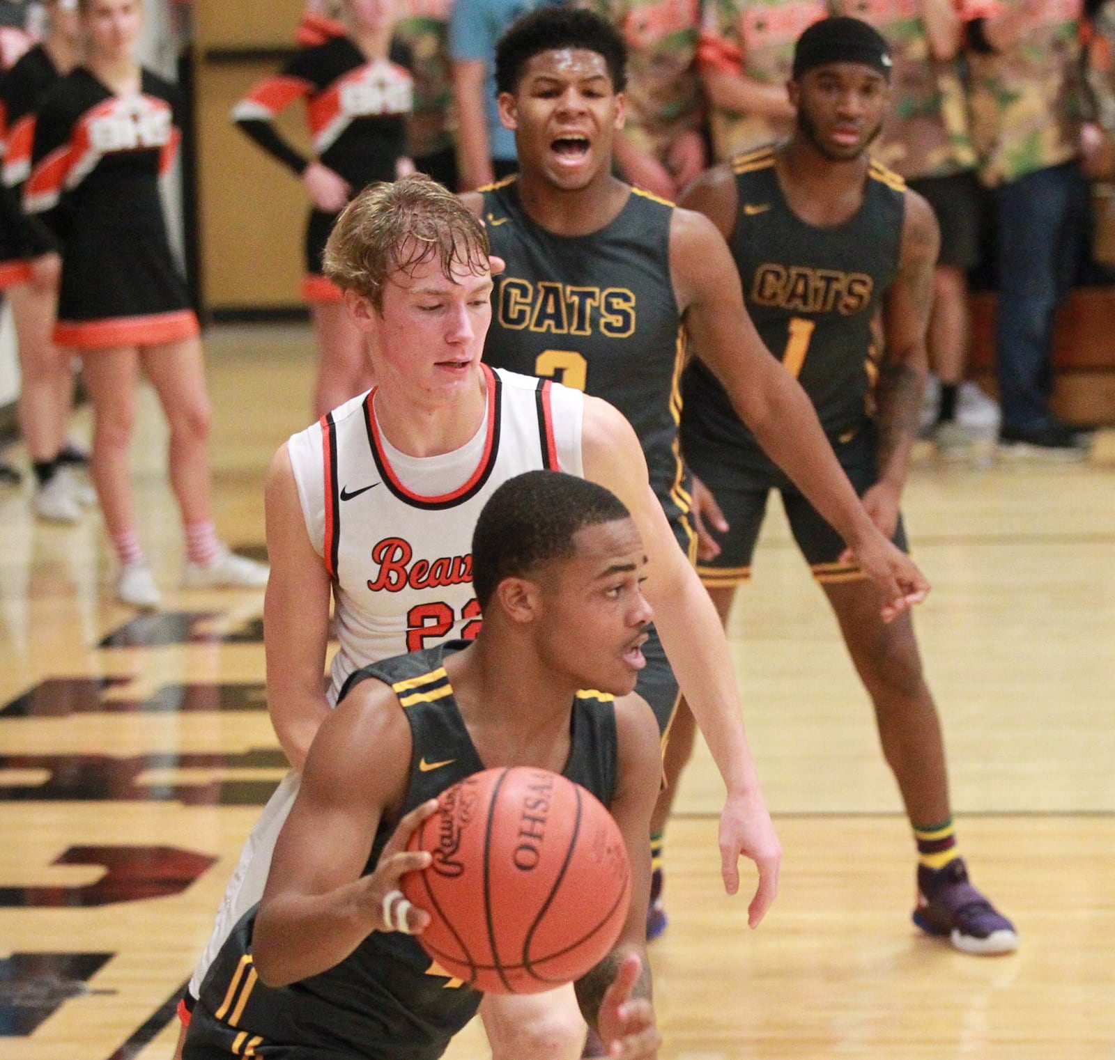 Ty Brown of Springfield (with ball) is checked by Adam Duvall of Beavercreek. Beavercreek defeated visiting Springfield 54-48 in a GWOC boys high school basketball game on Tuesday, Dec. 17, 2019. MARC PENDLETON / STAFF