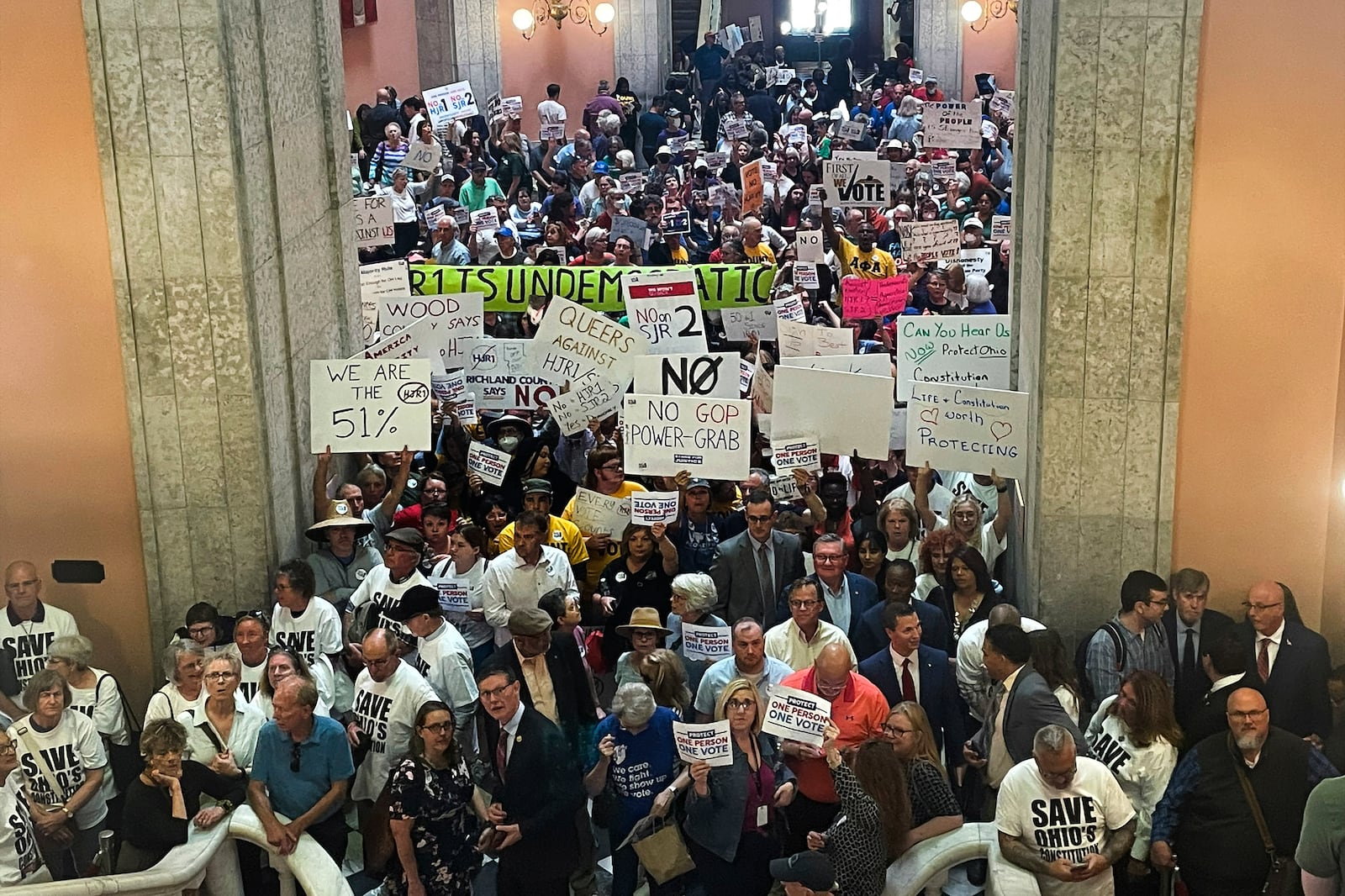 FILE - Supporters and opponents of a GOP-backed measure that would make it harder to amend the Ohio constitution packed the statehouse rotunda Wednesday, May 10, 2023, in Columbus, Ohio. In a blow to abortion opponents in Ohio, a fall ballot issue aimed at enshrining access to the procedure in state's constitution will not be split into two separate issues — one about abortion, and one about all other reproductive care.(AP Photo/Samantha Hendrickson, File)