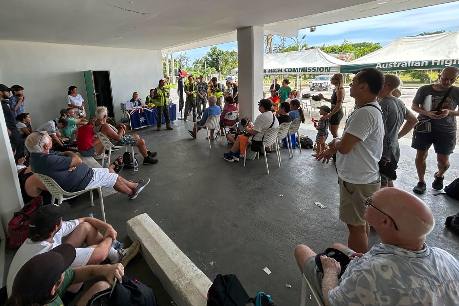 Australian citizen's are briefed on evacuation plans in Port Vila, Thursday, Dec. 19, 2024, following a magnitude 7.3 earthquake that struck off the coast of Vanuatu in the South Pacific Ocean, Tuesday, Dec. 17. (DFAT via AP)