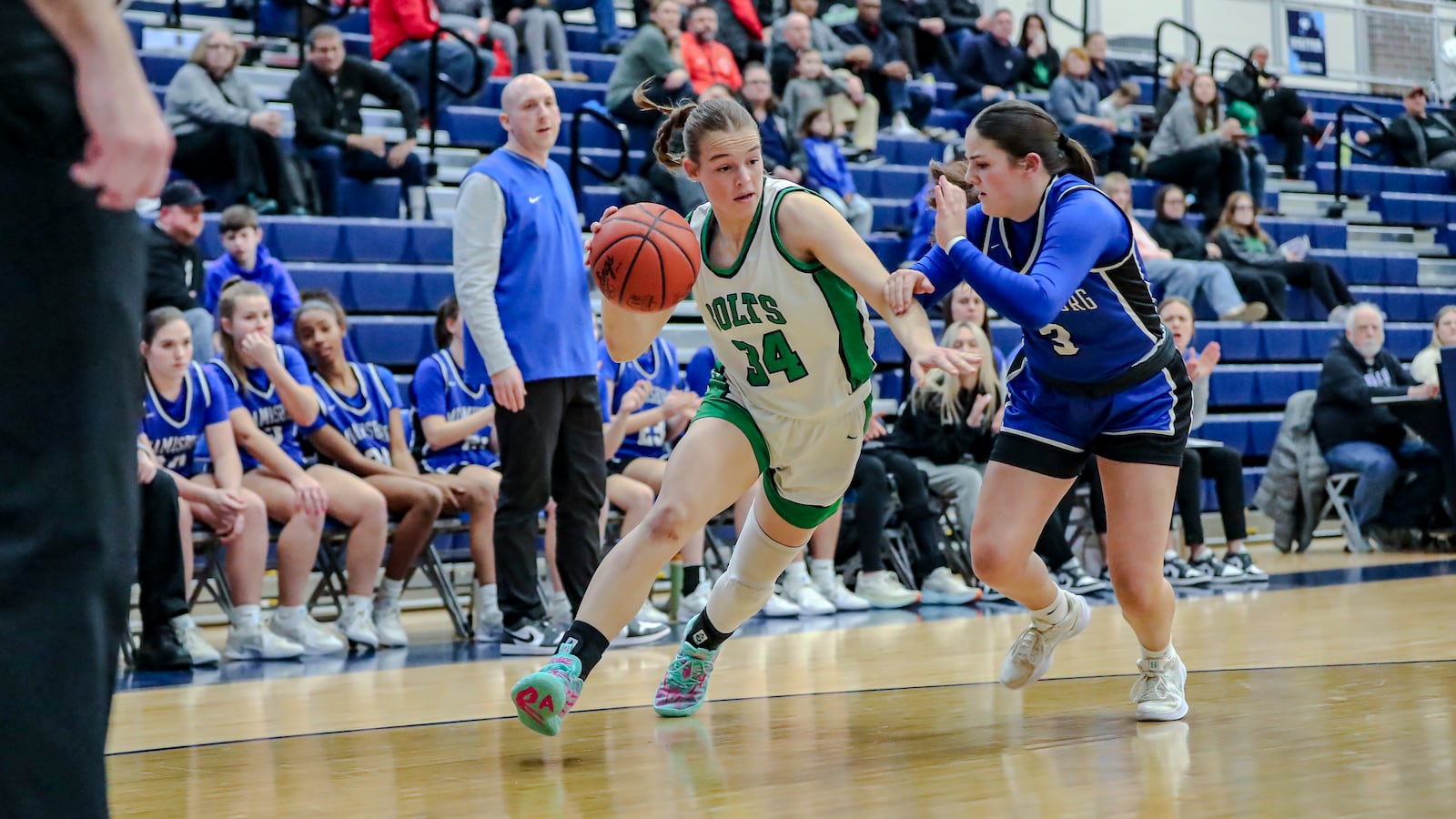 Northmont High School junior Ayla Rammel drives past Miamisburg's Addison Leber during a Division II district semifinal game on Monday night at Fairborn High School. MICHAEL COOPER/CONTRIBUTED