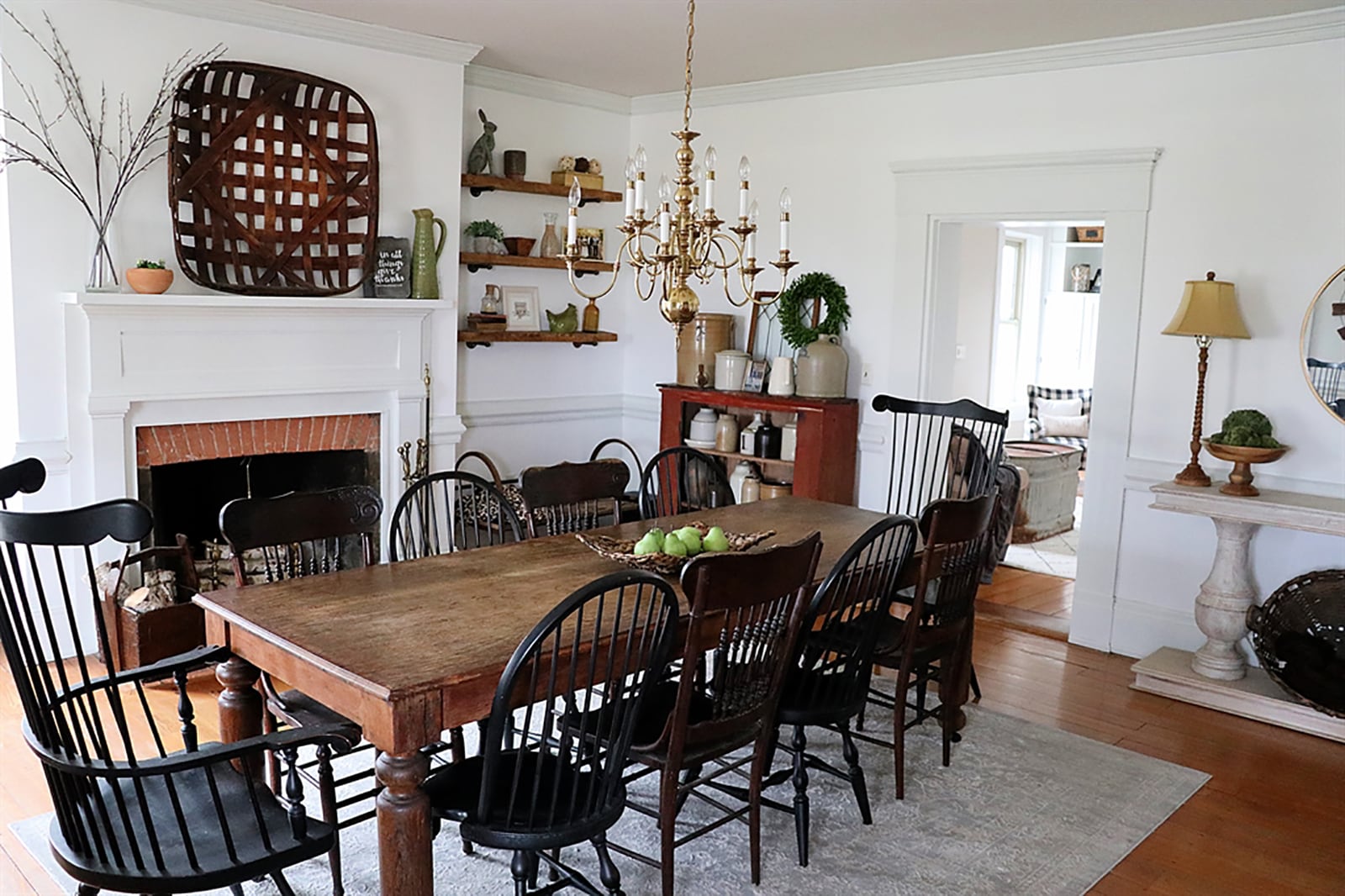 The dining room has a double chair railing and crown molding that give the walls texture and a decorative fireplace has brick accents and a wood mantel. The hardwood floor has been refinished to its original sheen. CONTRIBUTED PHOTO BY KATHY TYLER