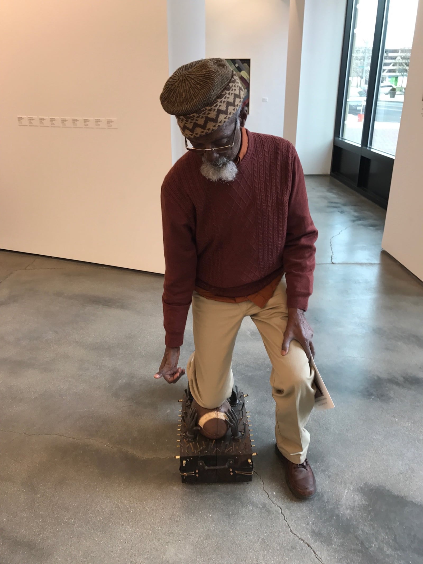 Bing 5 & Bing 6 -- Internationally acclaimed Dayton artist Bing Davis -- once a high school and college basketball & track star -- takes a knee on one of his kneelers  in his exhibit "Kneel" which ties together the silent protests of Colin Kaepernick and the murder of George Floyd. Tom Archdeacon/STAFF