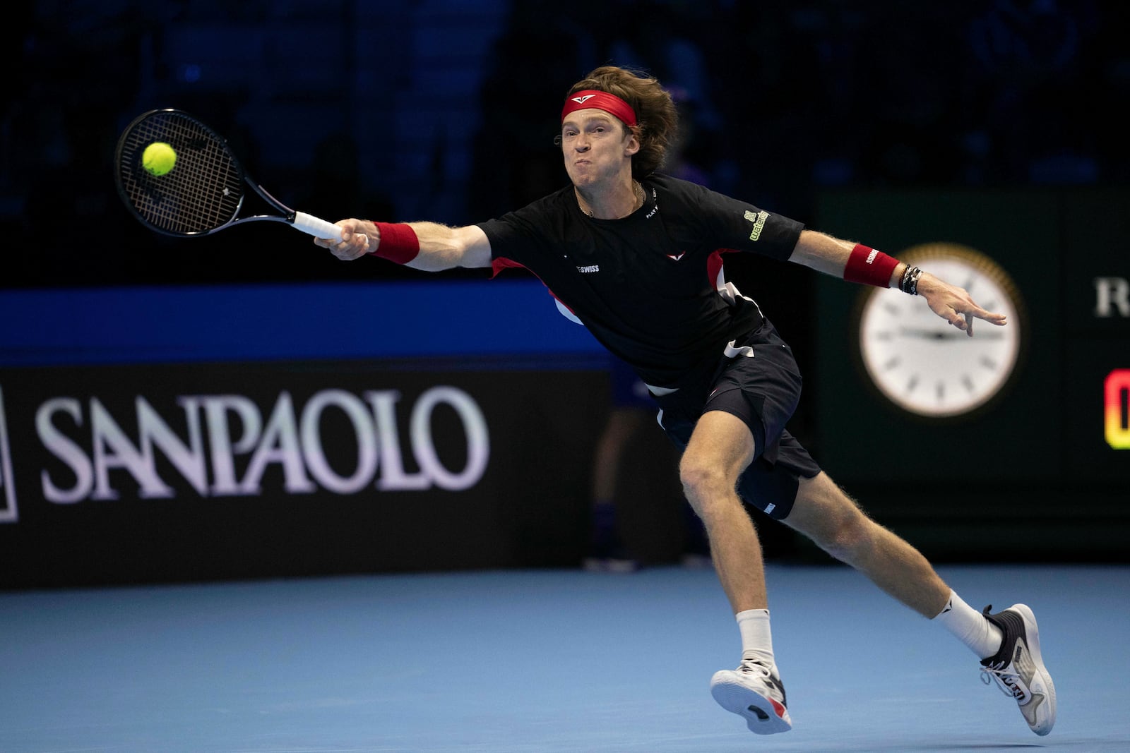 Russia's Andrey Rublev makes a return to Germany's Alexander Zverev at the ATP Finals tennis tournament in Turin, Italy, Monday, Nov. 11, 2024. (Marco Alpozzi/LaPresse via AP)