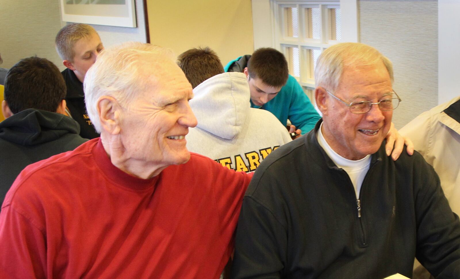 Chris Harris, right, and Bill Uhl smile during a breakfast with other Dayton teammates in 2013. CHRIS STEWART / STAFF