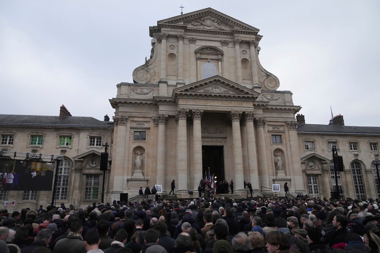 People gather outside Notre Dame du Val-de-Grace church during a public memorial for late far-right leader Jean-Marie Le Pen, Thursday, Jan. 16, 2025 in Paris. Jean-Marie Le Pen, the founder of France's main far-right party, died on Jan.7, 2025 aged 96. (AP Photo/Michel Euler)