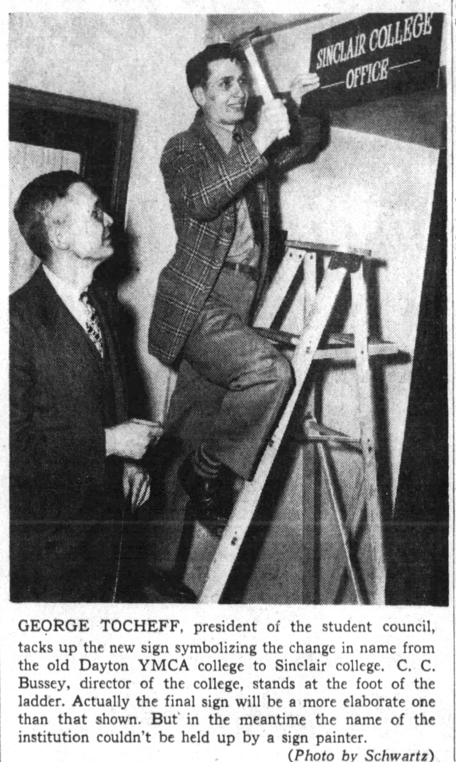 A student hangs a sign after the renaming of YMCA College to Sinclair College. DAYTON DAILY NEWS ARCHIVES