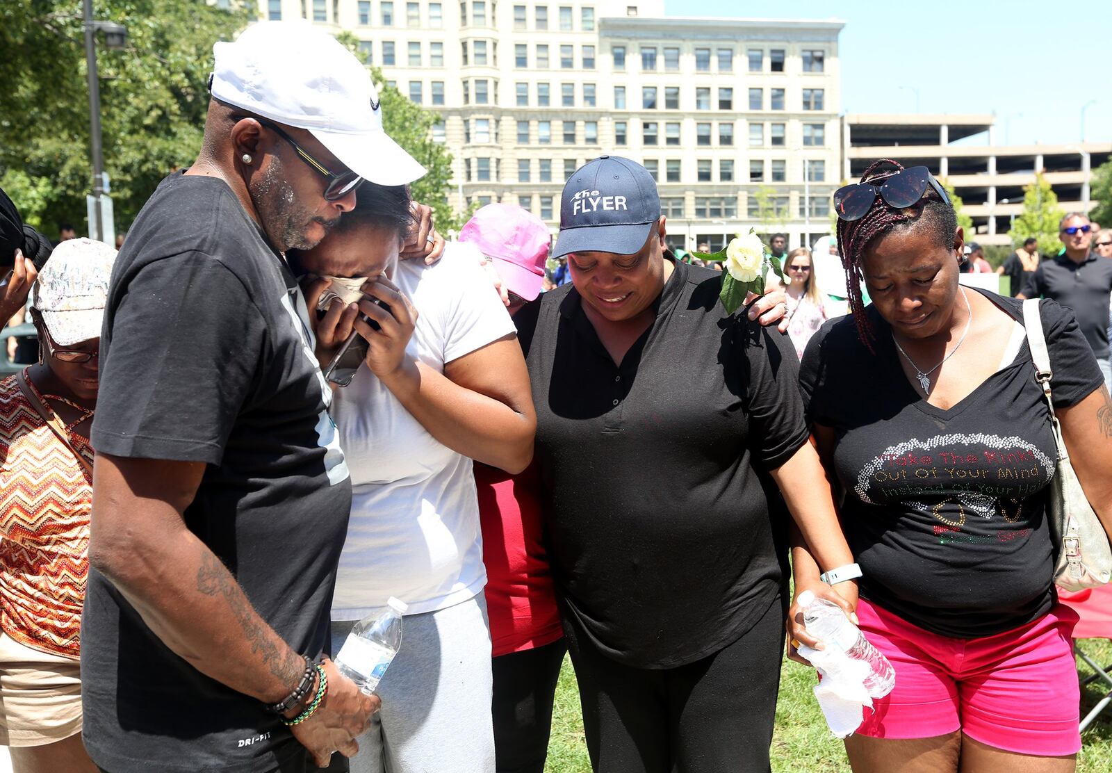 The family of Thomas McNichols, one of the people killed in Dayton’s Oregon District, attended a prayer gathering Sunday at the Levitt Pavilion. Second from left is Jamila McNichols, his sister and third from left is Donna Johnson, his aunt. “He was a loving kid,” Johnson said. “He came home yesterday from work and we were watching television and eating Twizzlers.” LISA POWELL / STAFF